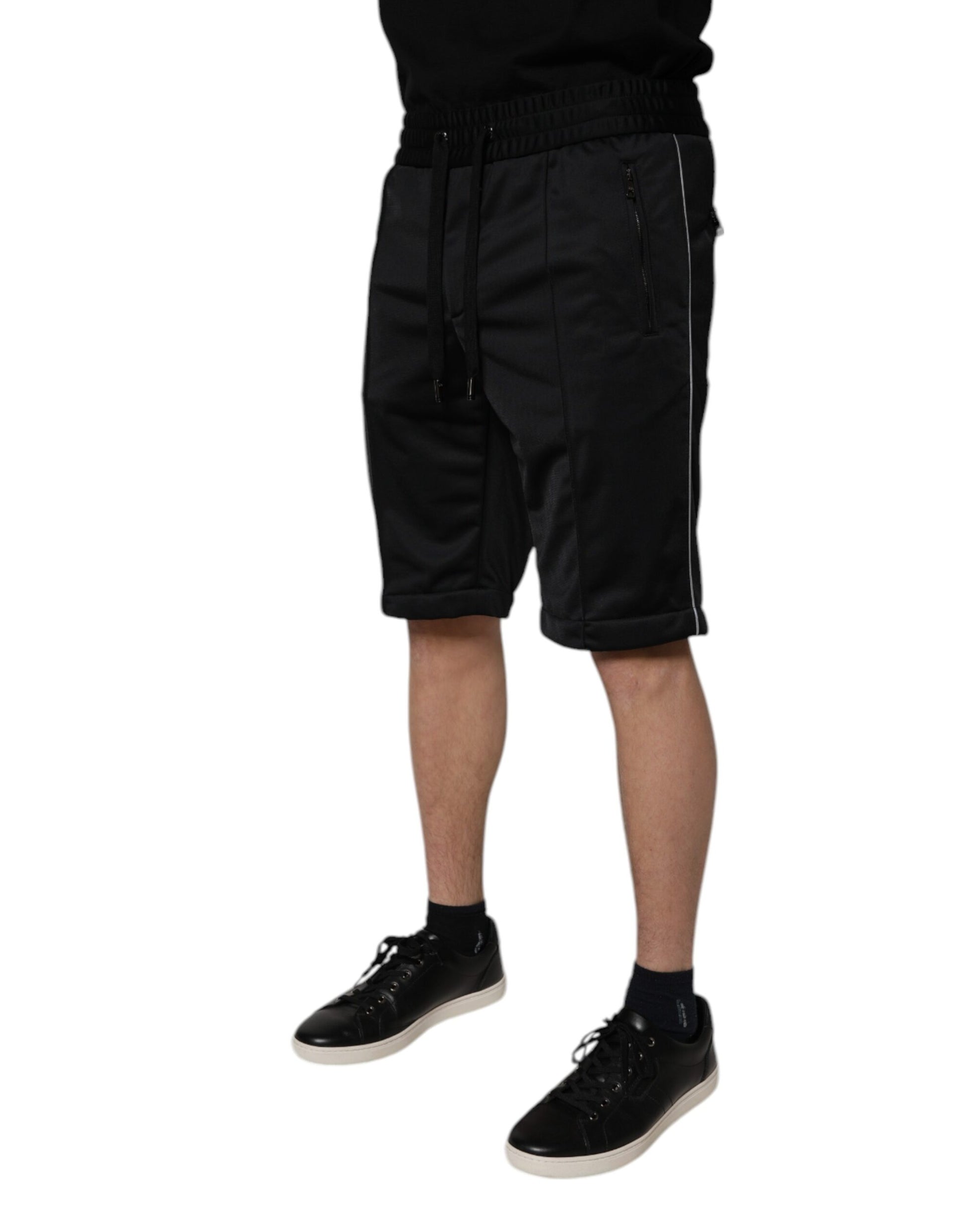 A pair of black polyester mid waist men's bermuda shorts