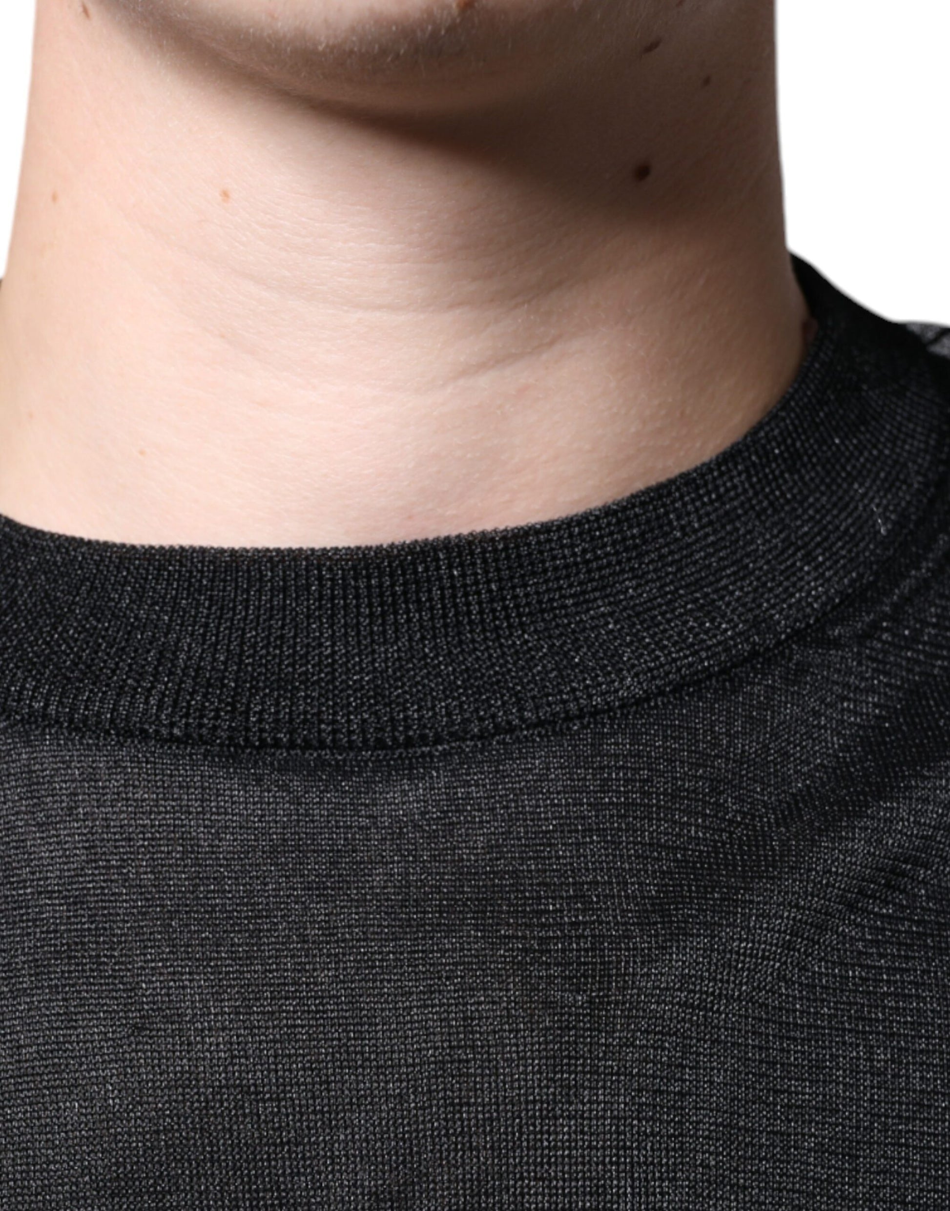 Black shirt on man's neck