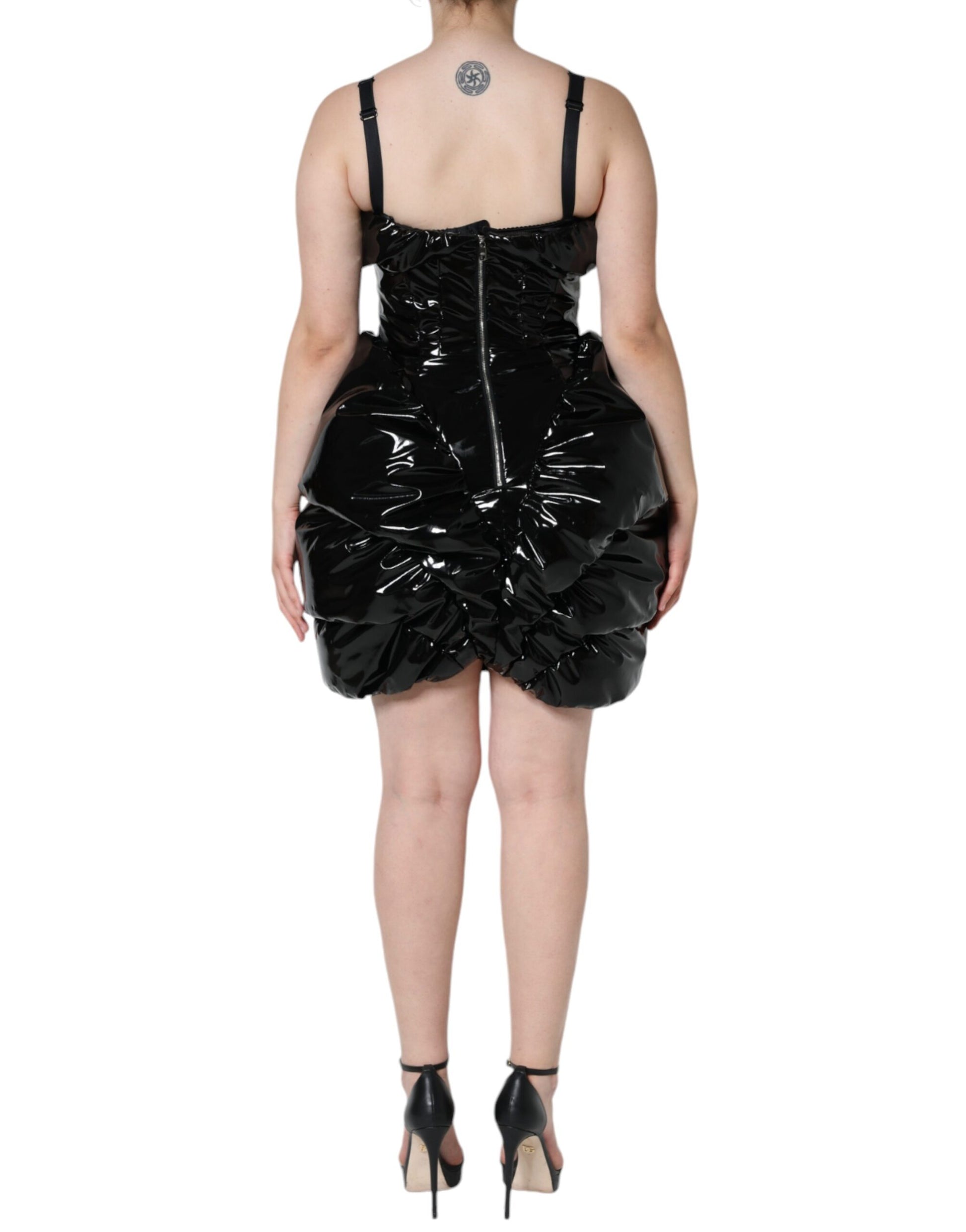 A black polyester ruched coated mini dress with a fitted silhouette and high neckline