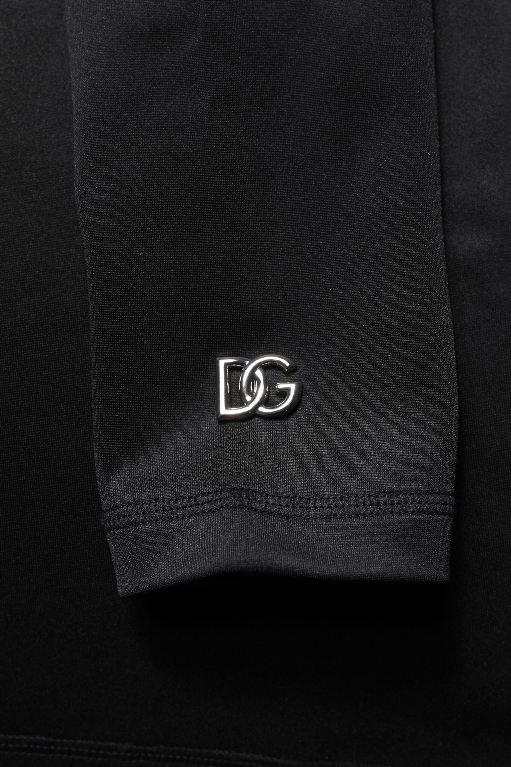 Black sock with a silver logo on it