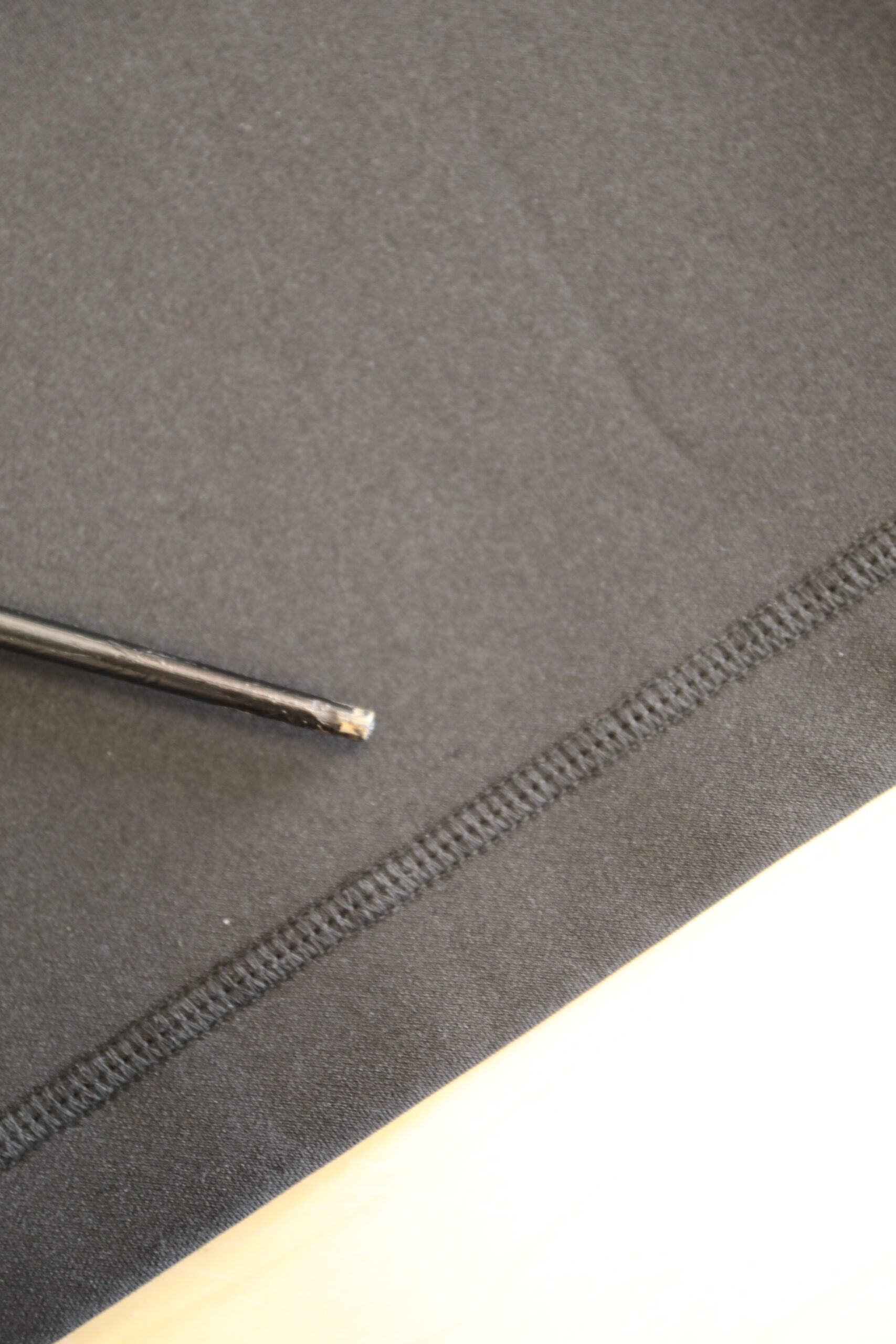 Black fabric with zipper on edge