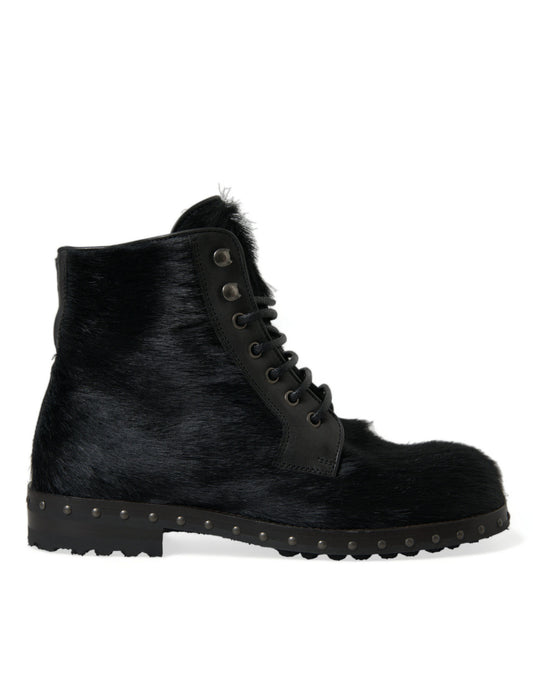 Fur lined black boot with laces and a buckle