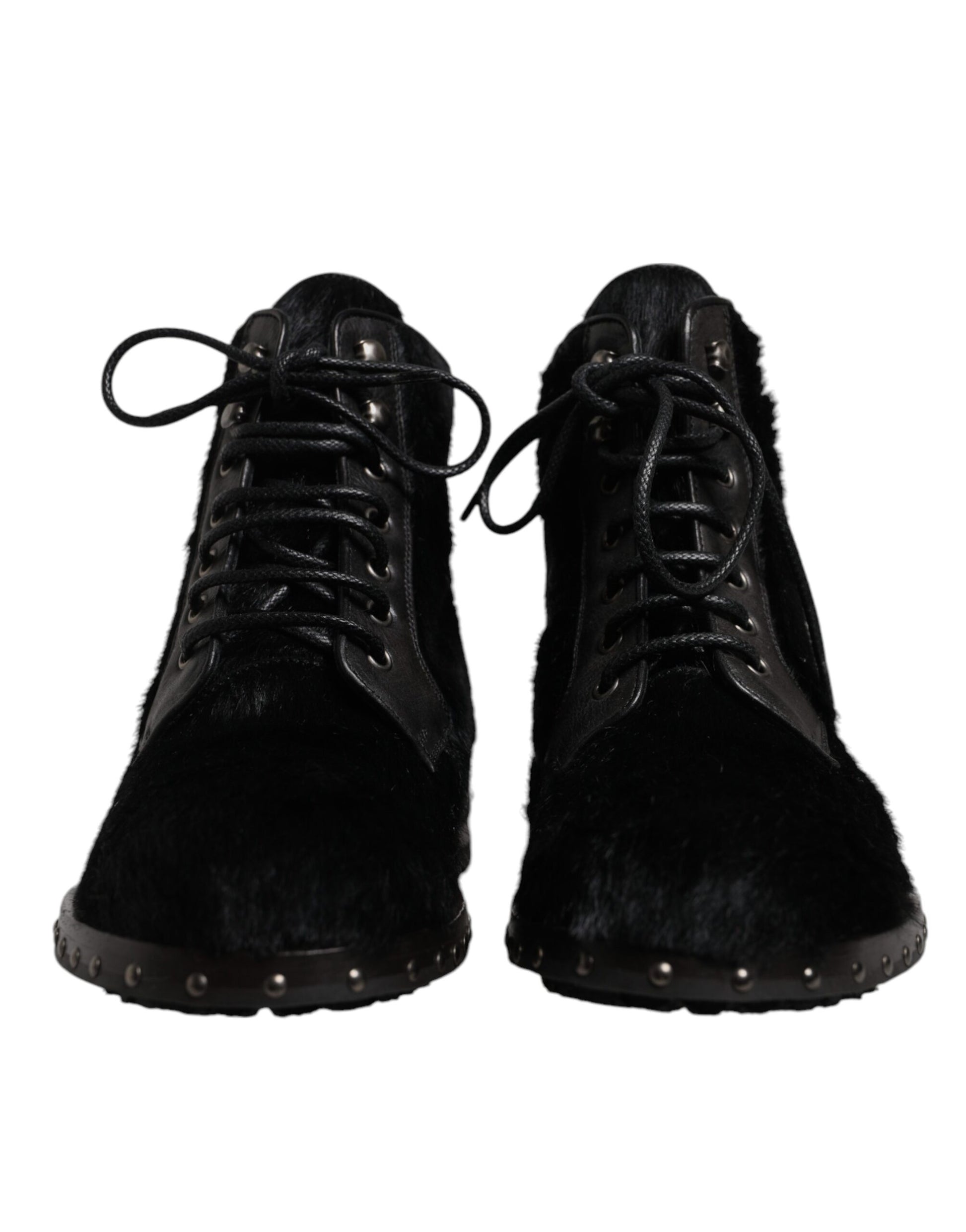 Pair of black fur boots with laces