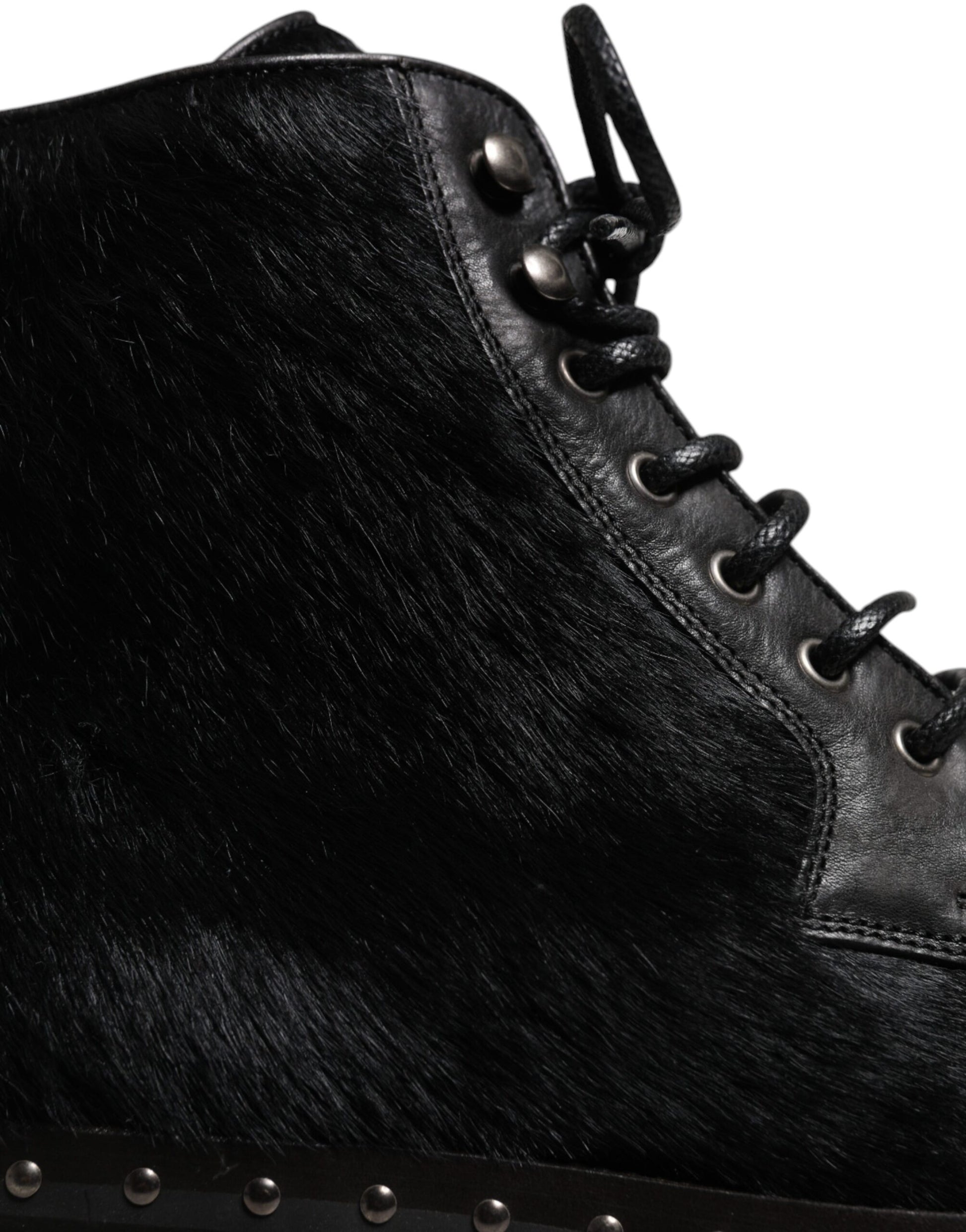 Fur lined black boot with laces and metal eyelets