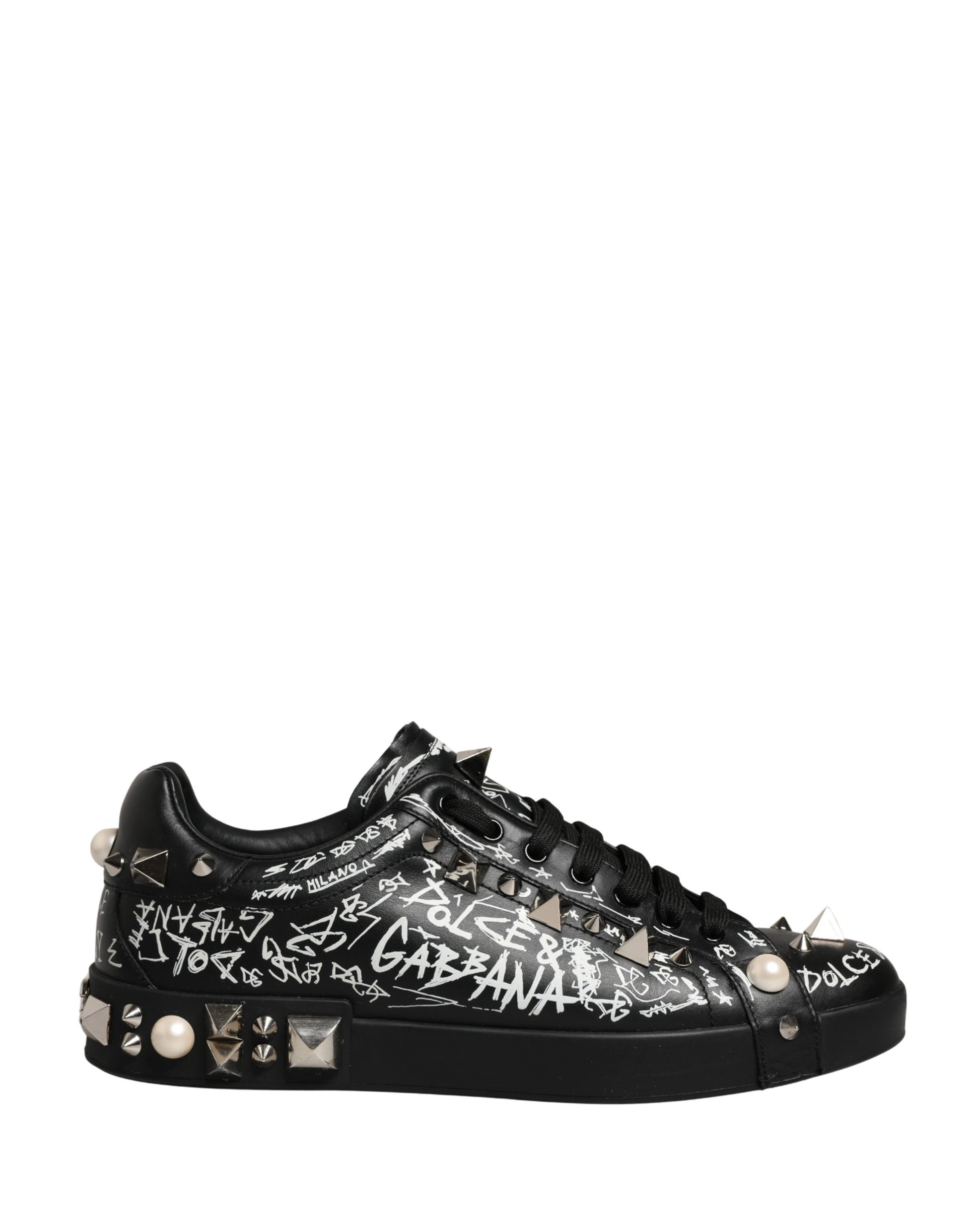 Black sneakers with graffiti text, studs and pearls on the side