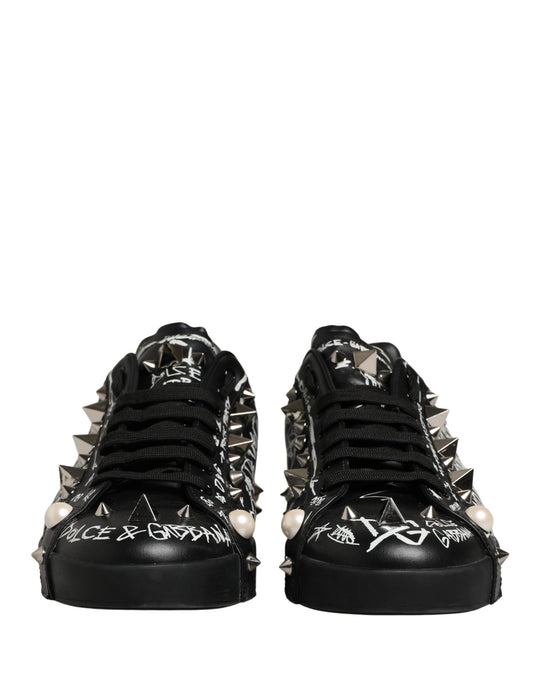 Pair of black D&G sneakers with graffiti design and studs
