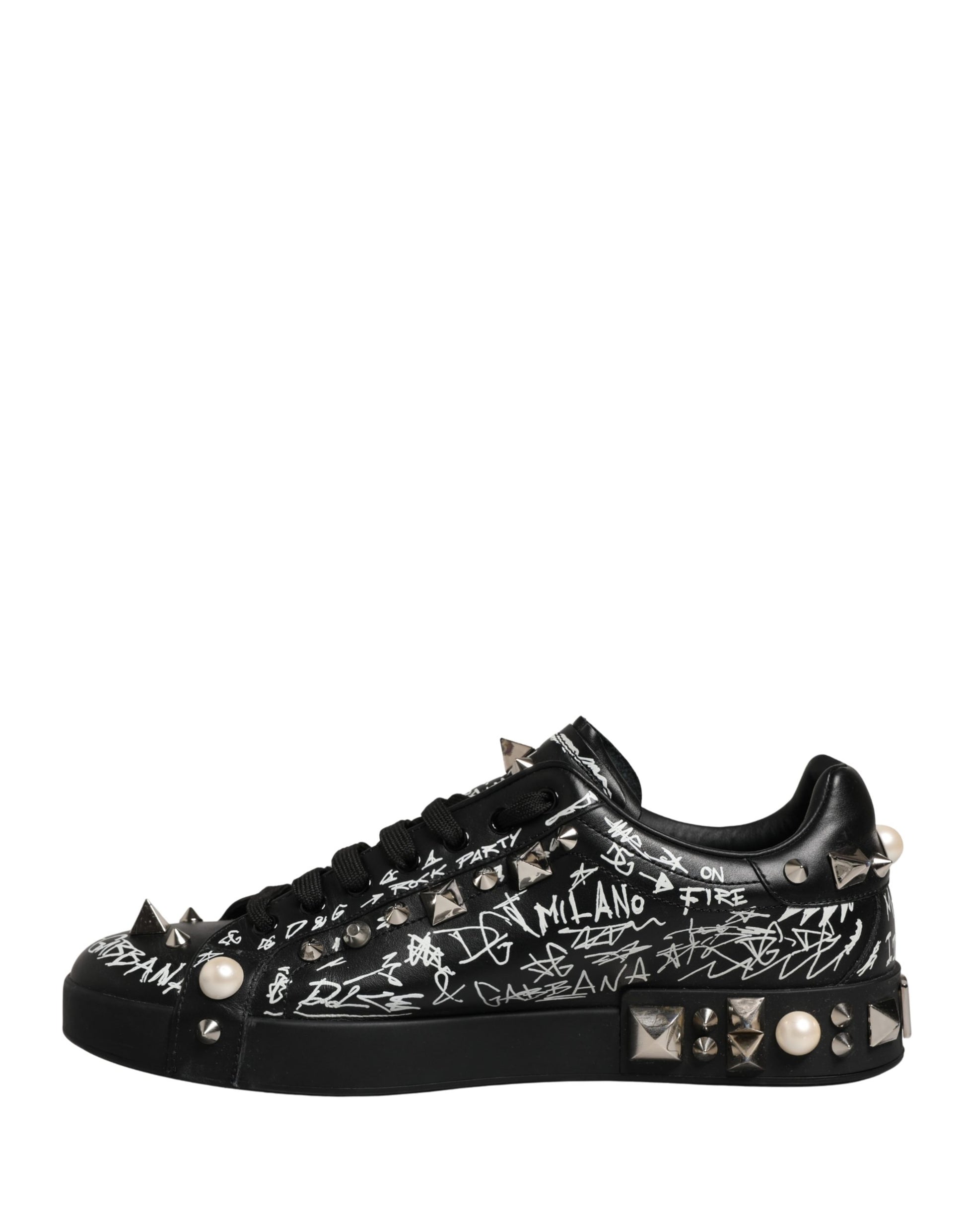 A pair of black sneakers with graffiti design and studs, featuring the word "Milan" on the side