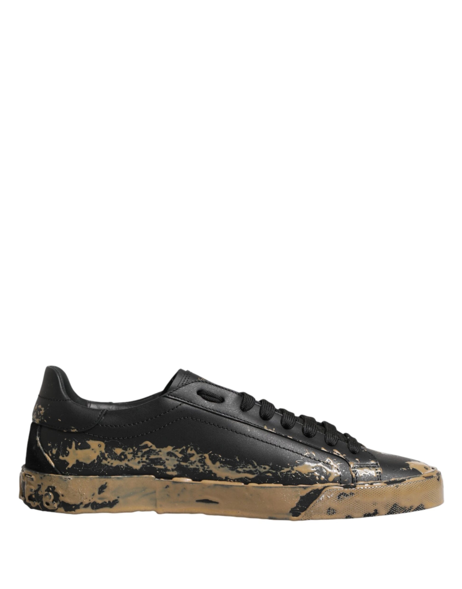 A pair of black sneakers with mud effect, featuring a low top and a white sole