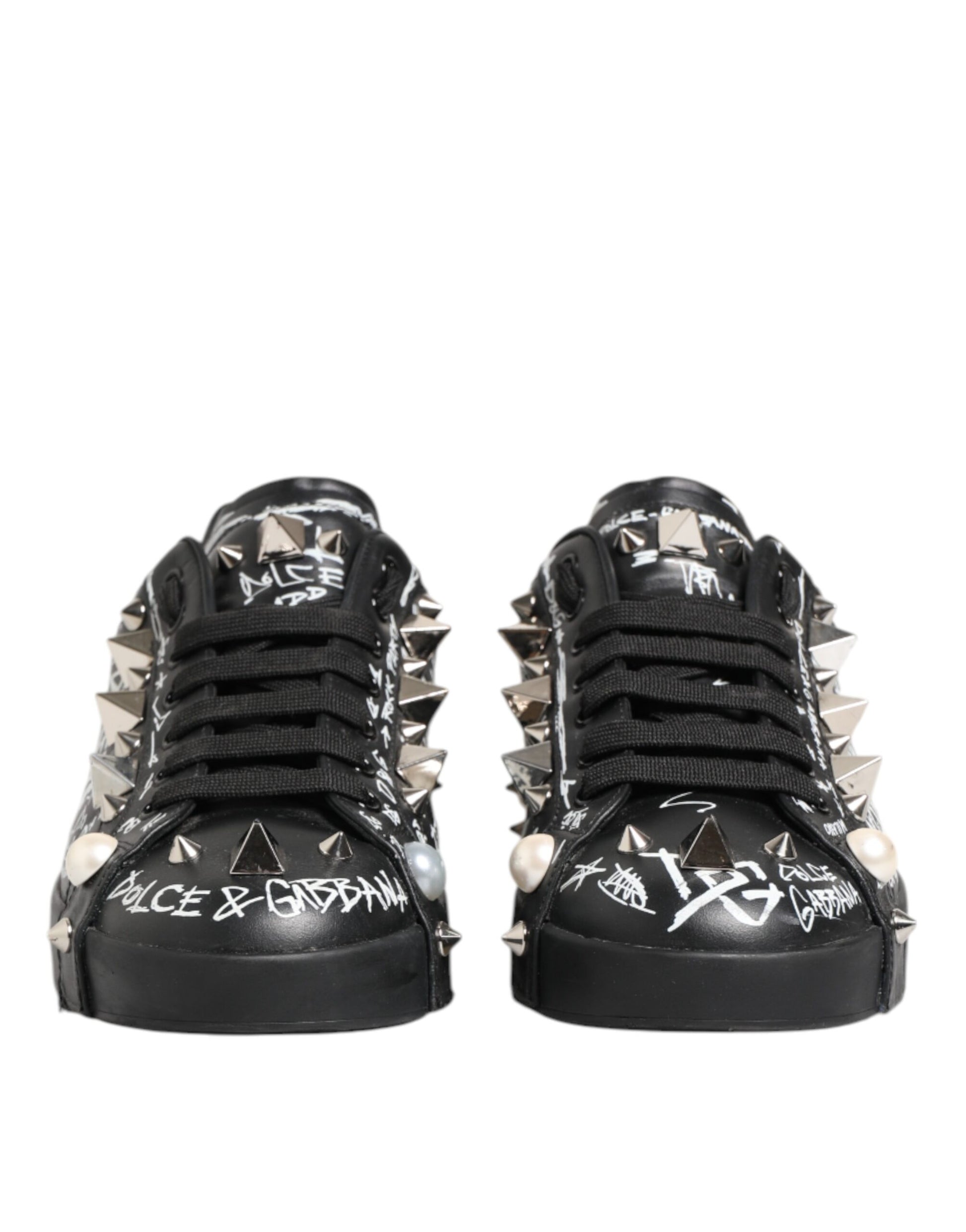 Pair of black D&G sneakers with studs and writing on side