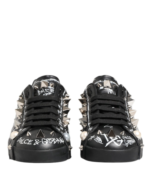 Pair of black D&G sneakers with studs and writing on side