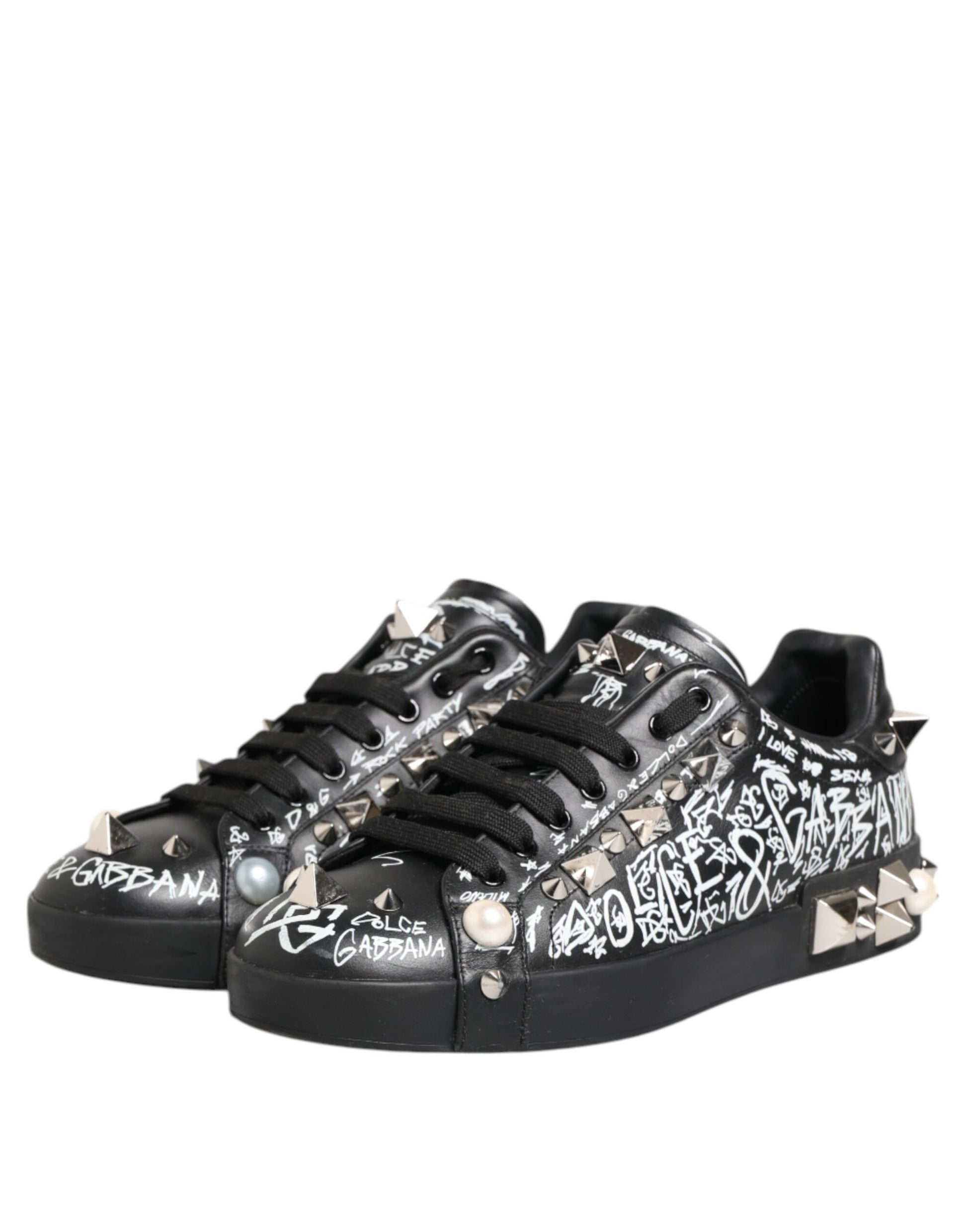 Black sneakers with studs, embellishments and text on side
