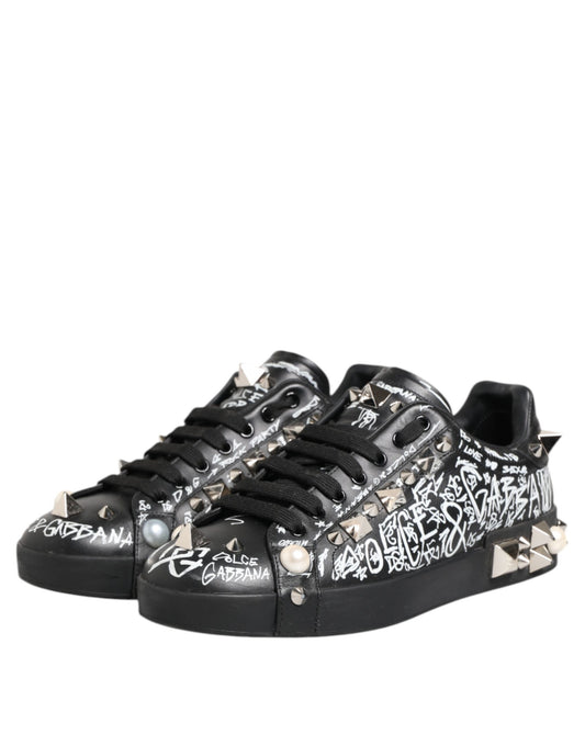 Black sneakers with studs, embellishments and text on side