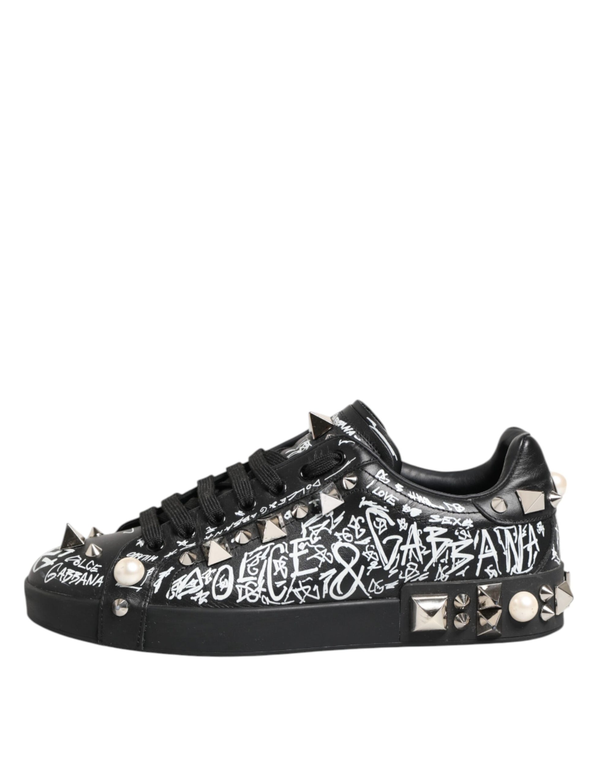 A pair of black D&G sneakers with studs and a patterned design