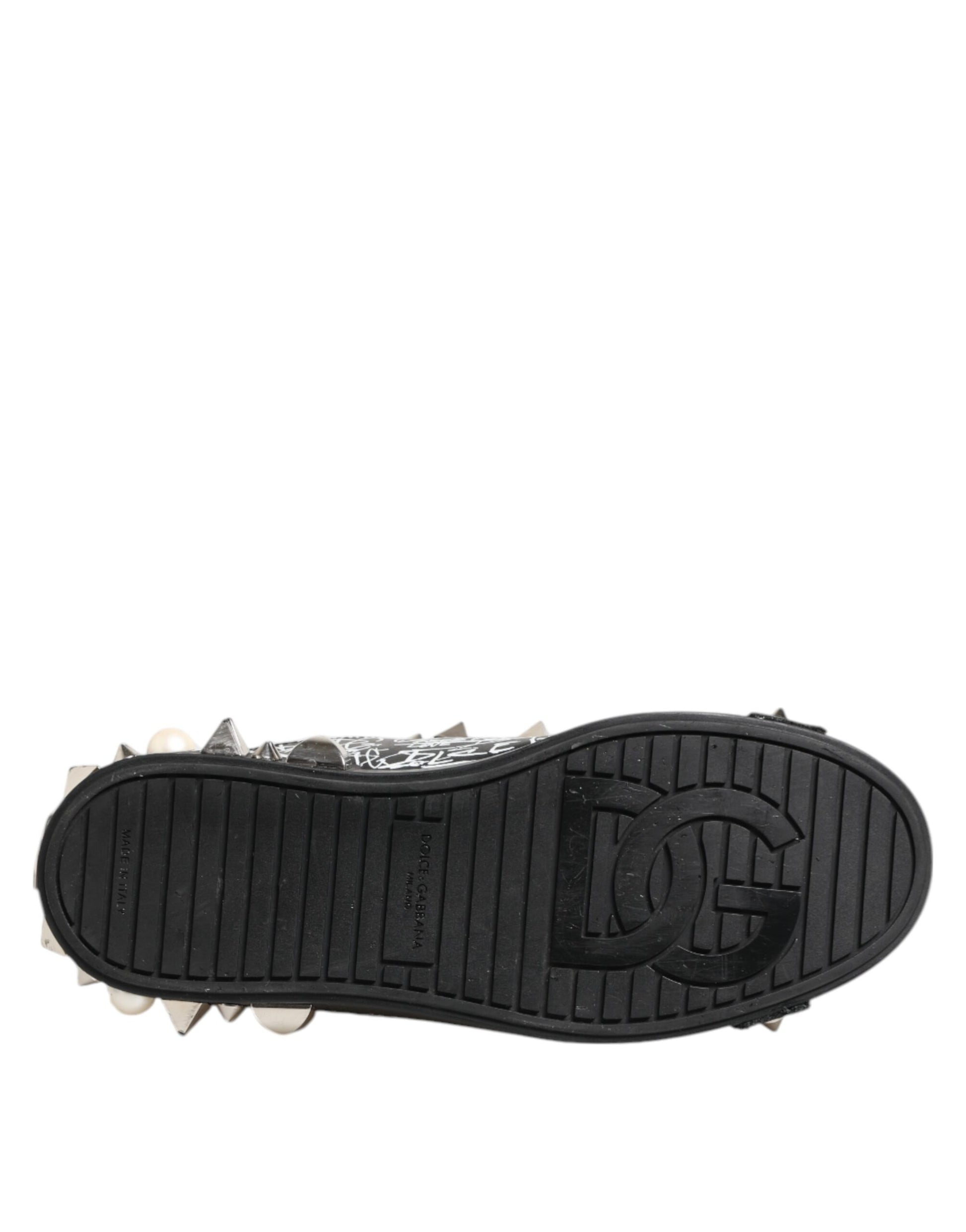 A single black sneaker with a studded design on the sole and heel, featuring the Dolce & Gabbana logo