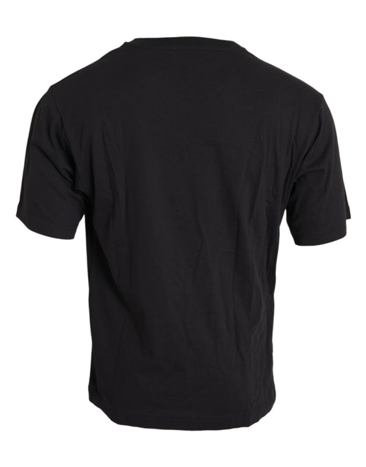 Black short sleeve t-shirt on a hanger