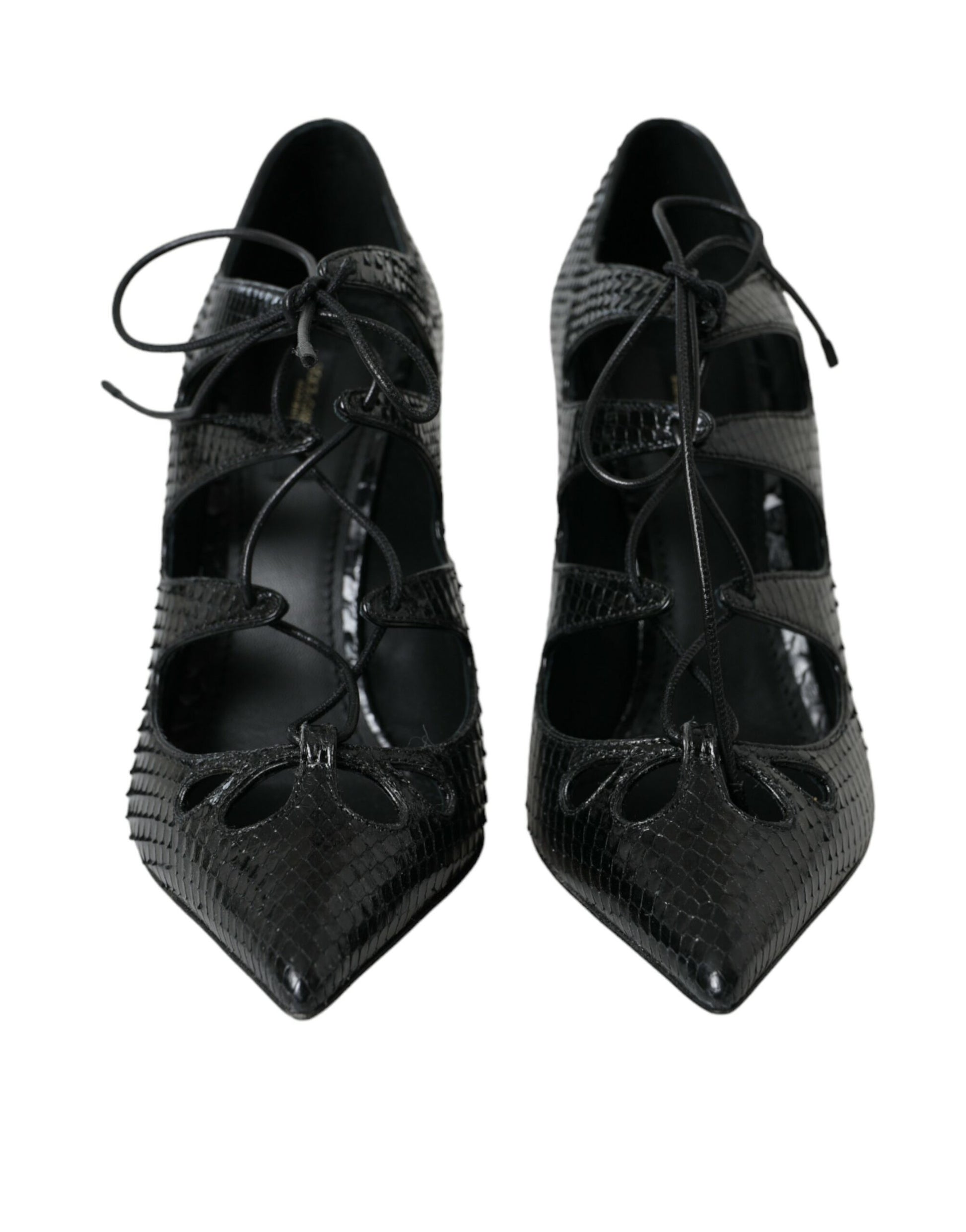 Pair of black high heel shoes with embellishments and straps