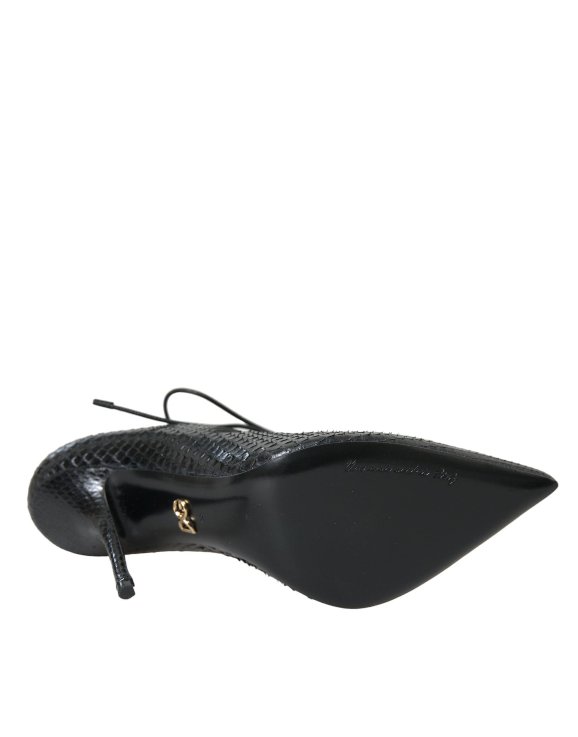 Black high heel shoe with a pointed toe and a strap across the foot