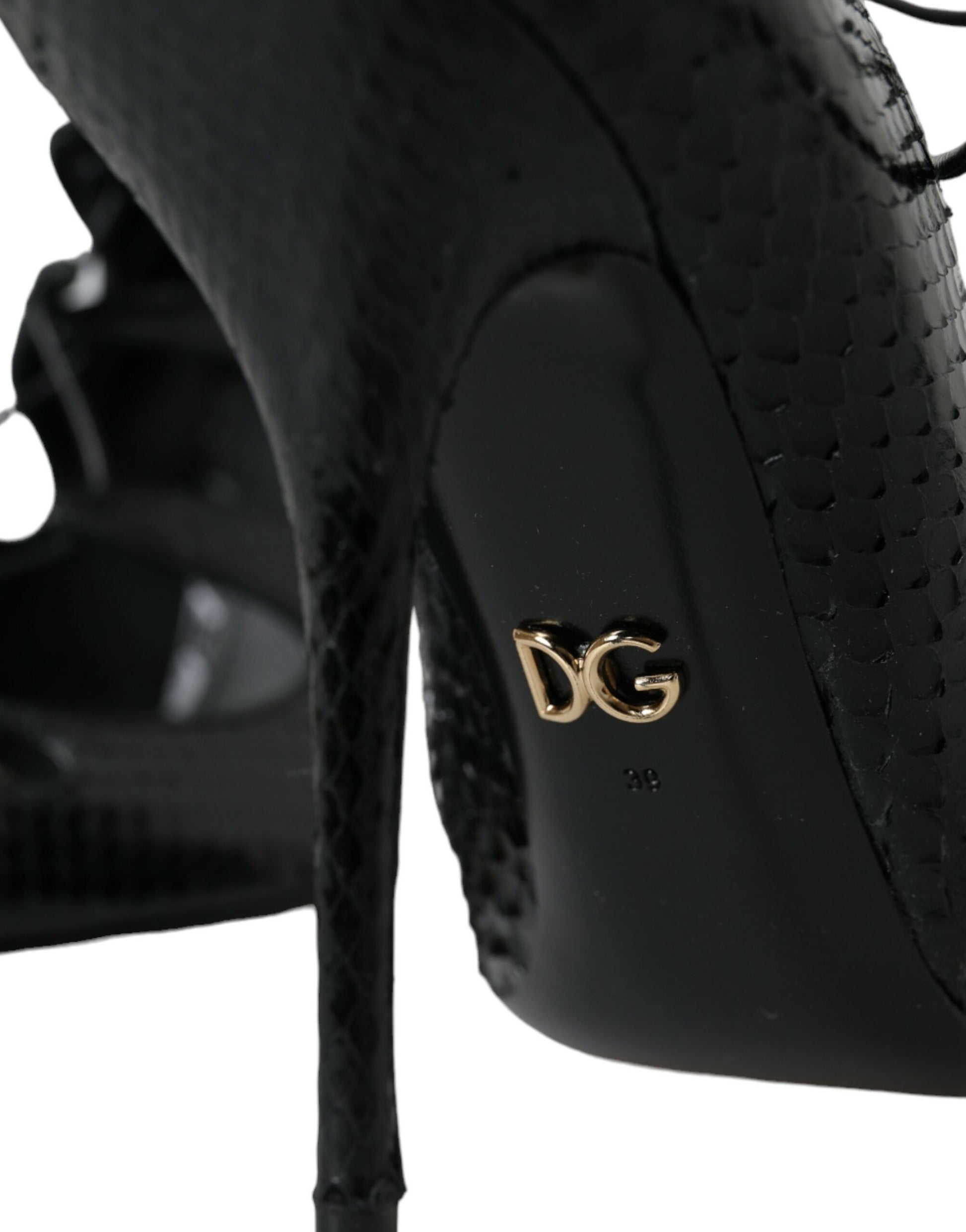 Black high heel shoe with gold logo on side