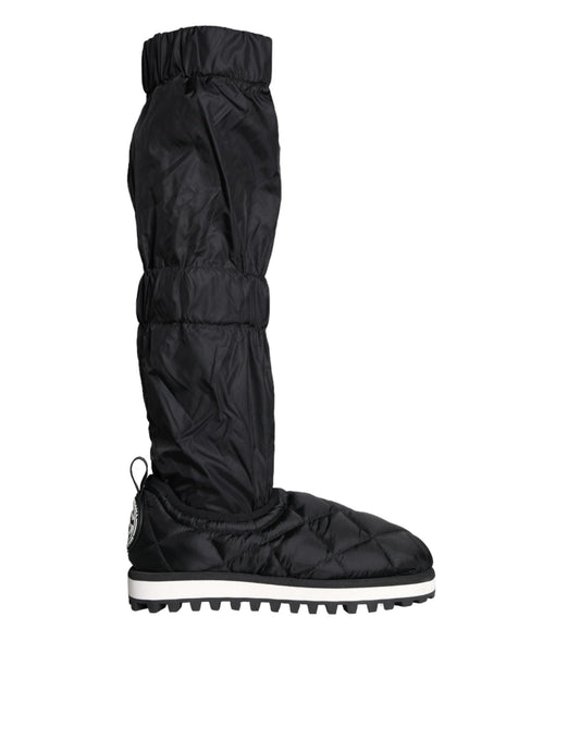 Pair of black waterproof boots with white soles