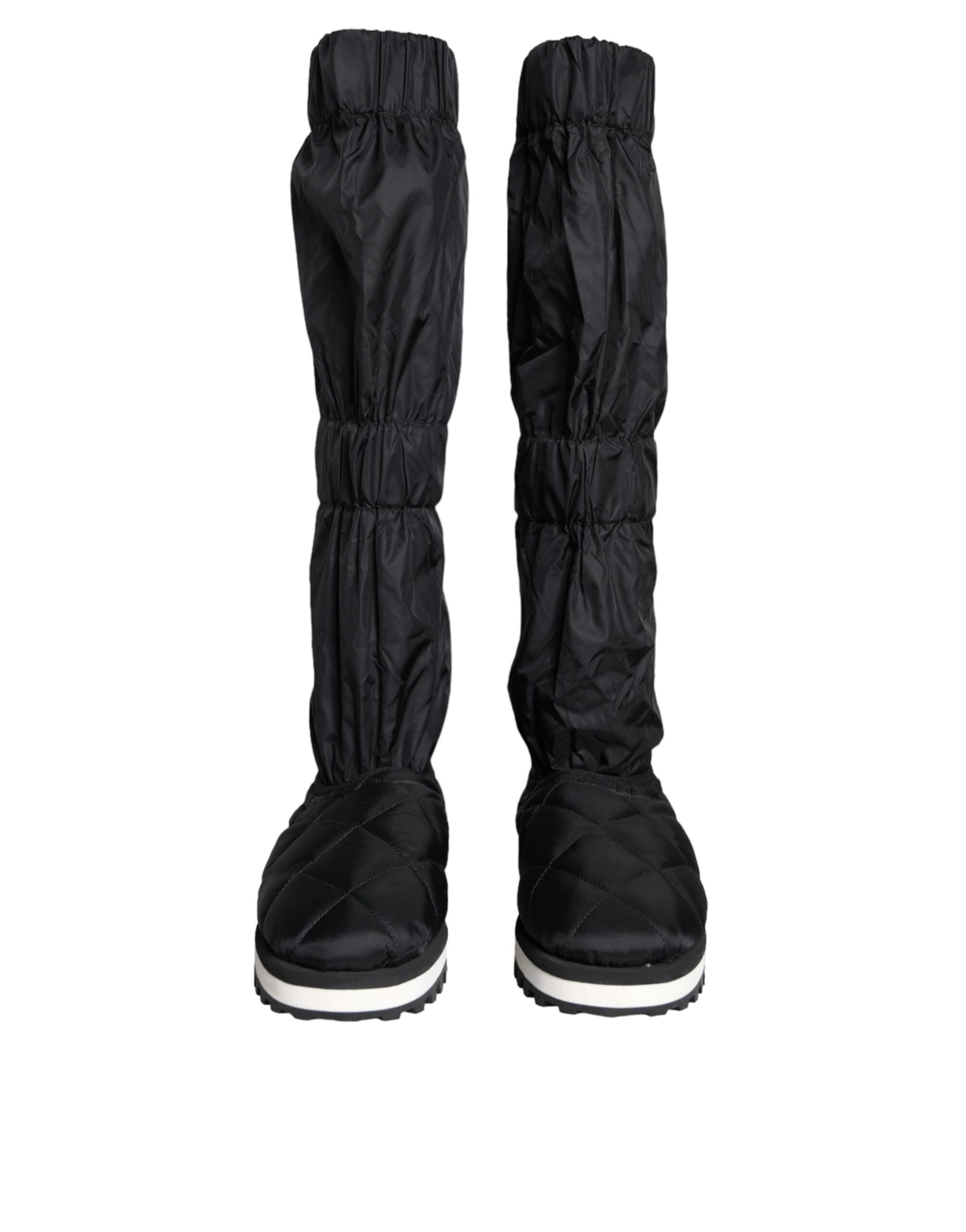 Pair of black rain boots with white soles