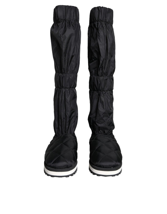 Pair of black rain boots with white soles