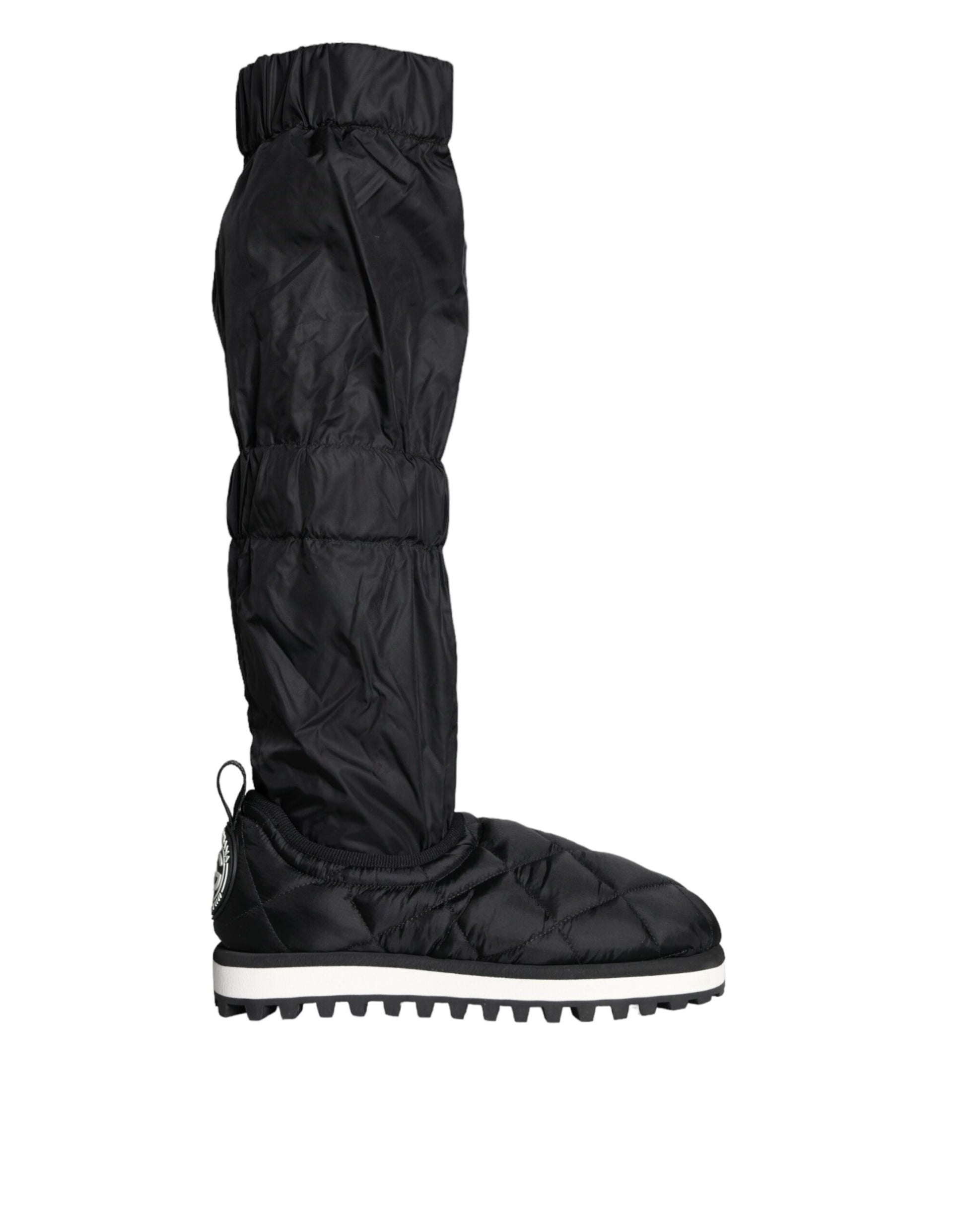 Pair of black waterproof boots with white soles