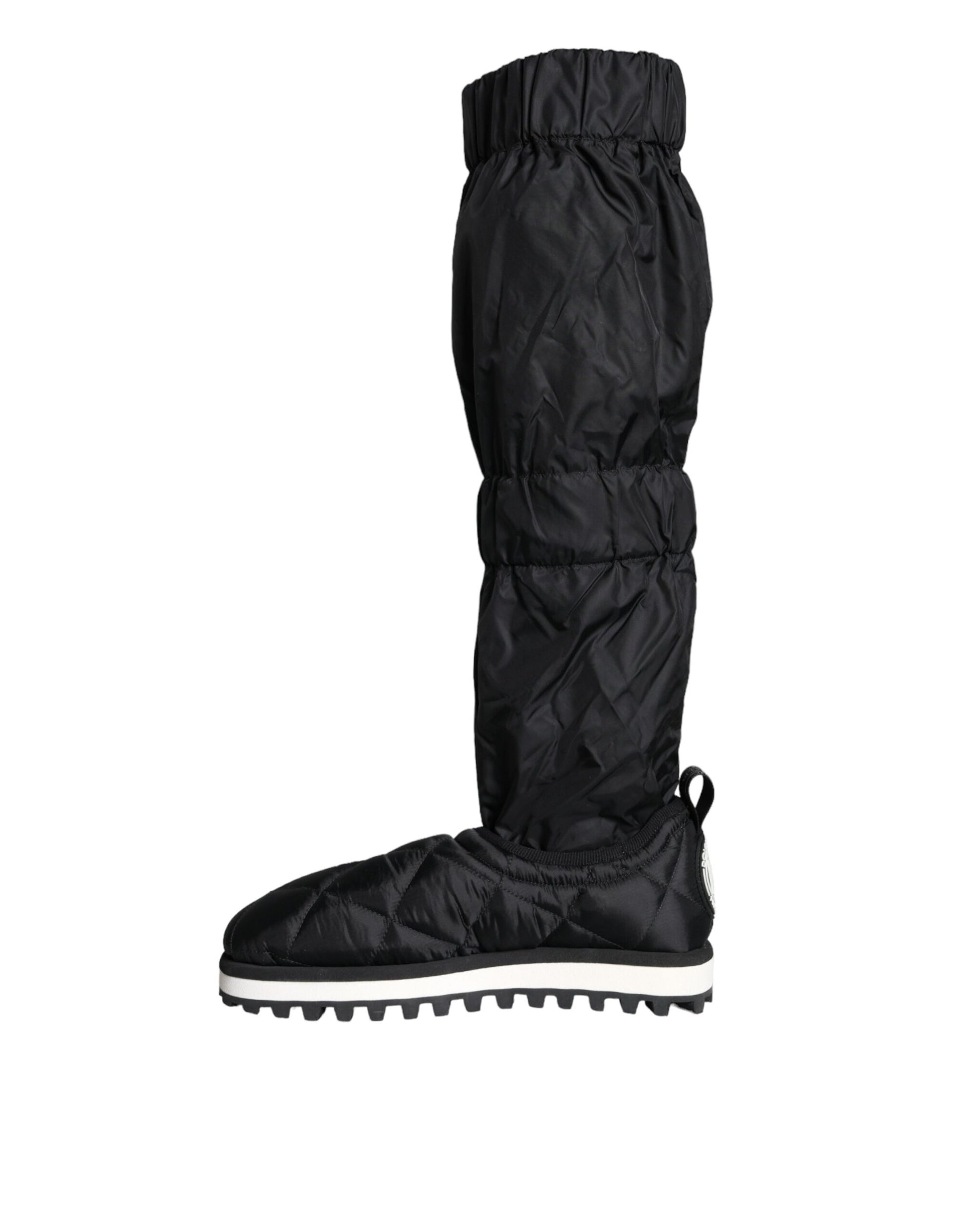Pair of black waterproof boots with white soles and laces