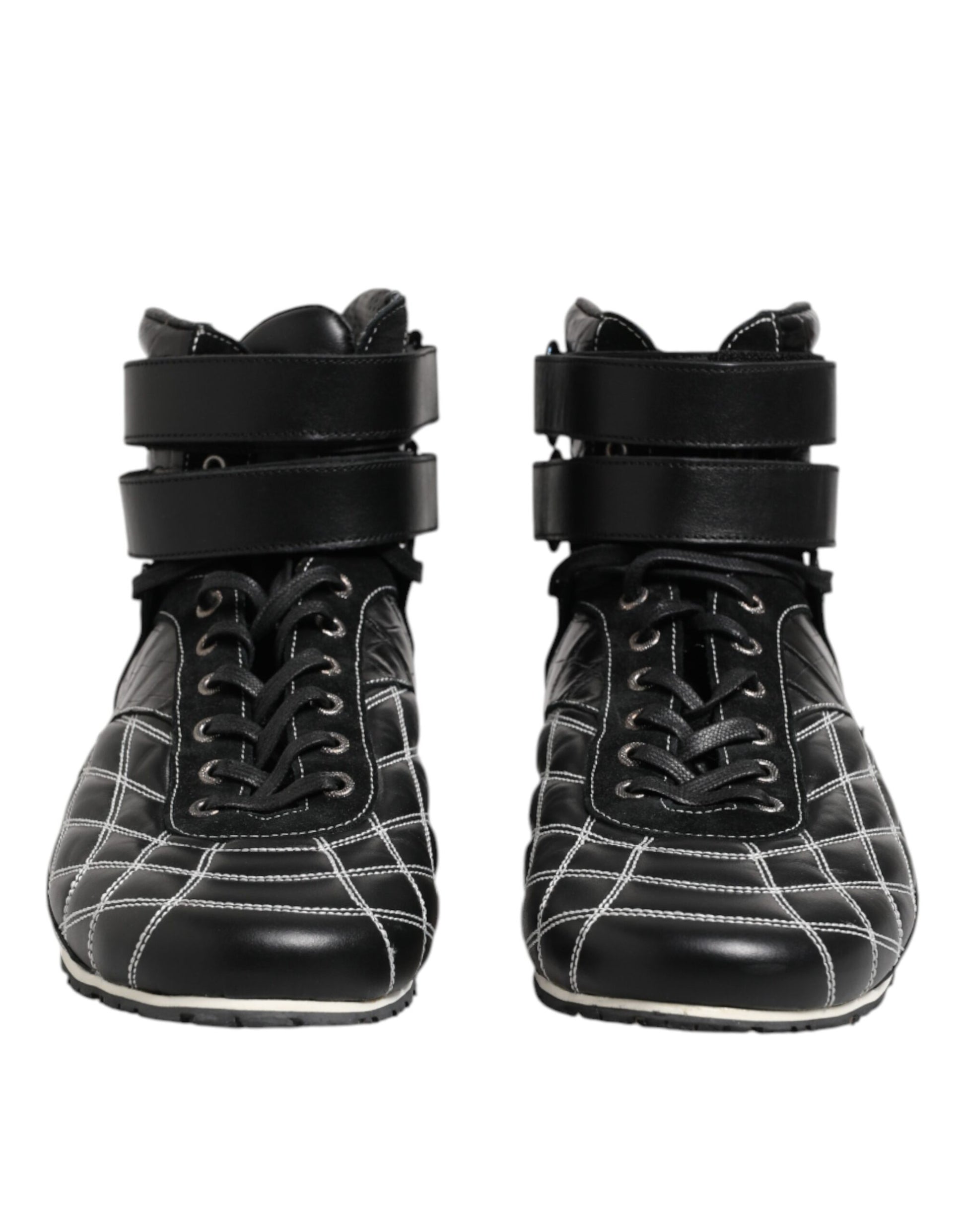 Pair of black leather boots with laces and buckles