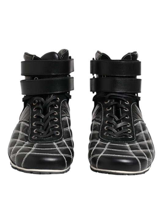 Pair of black leather boots with laces and buckles