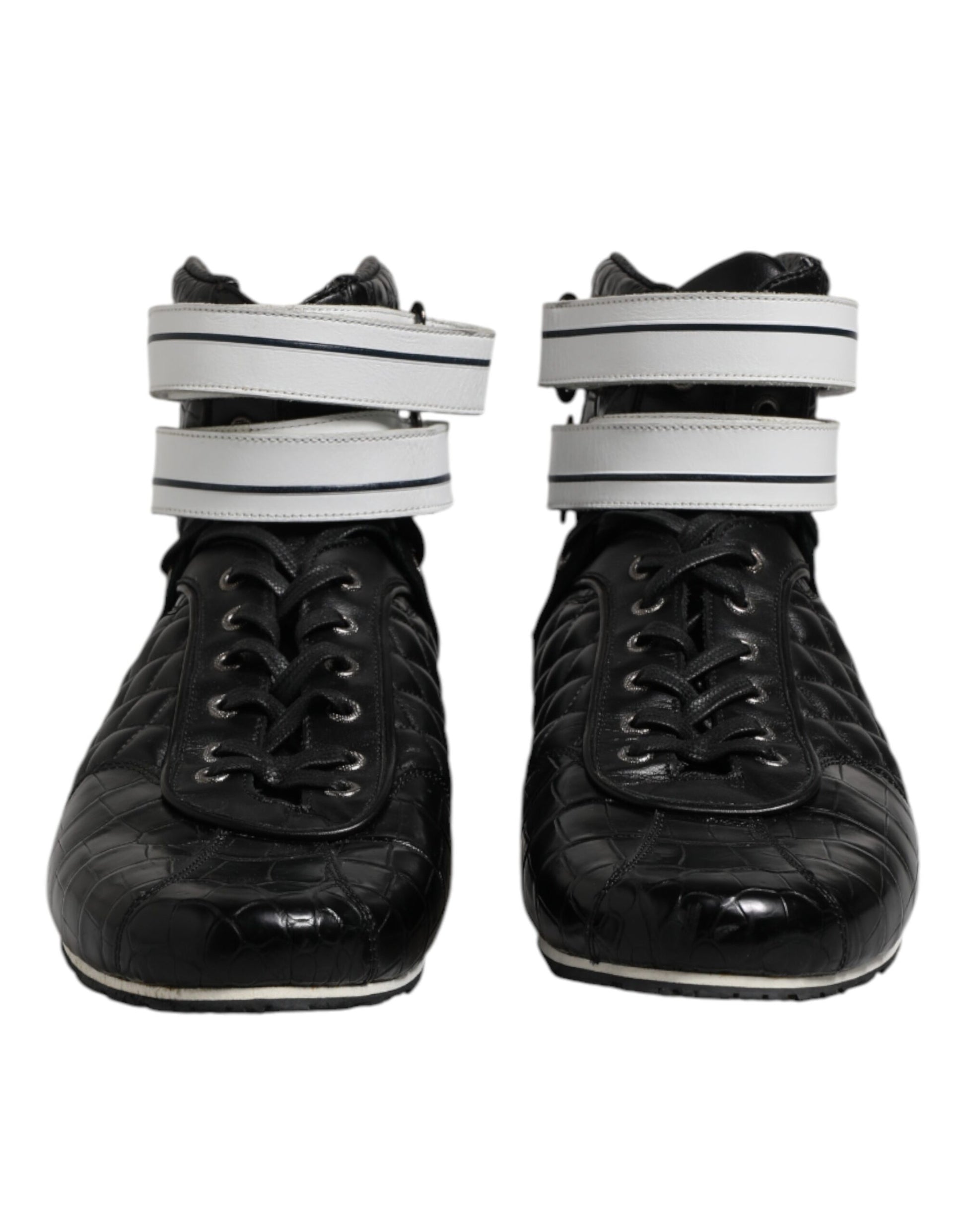 Pair of black ice skates with white straps