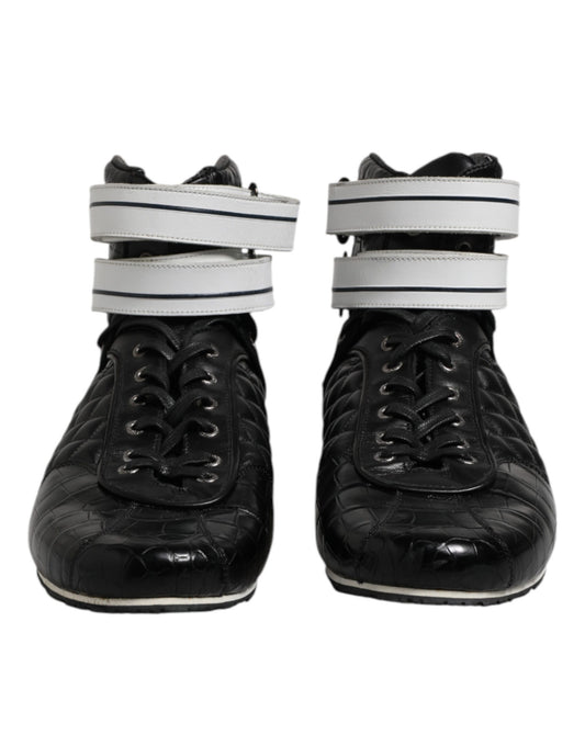 Pair of black ice skates with white straps