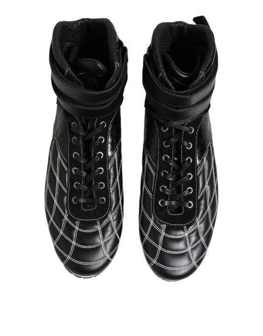 Pair of black boots with laces and buckles