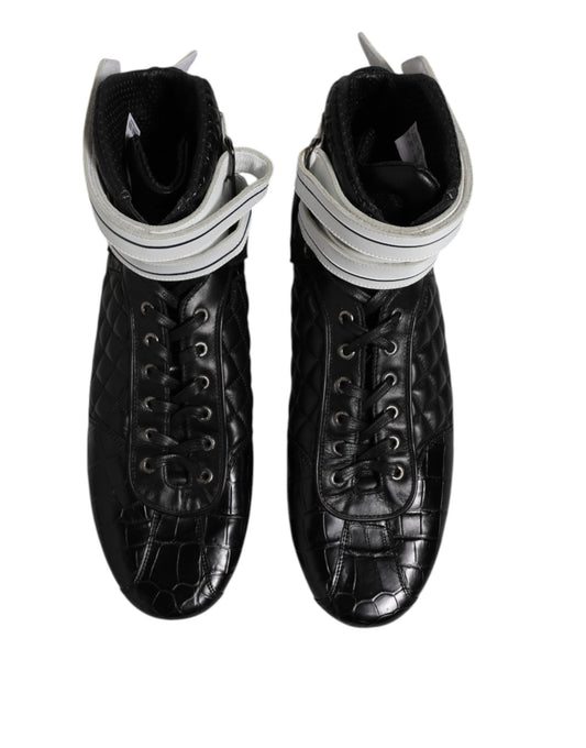 Pair of black leather boots with silver buckles