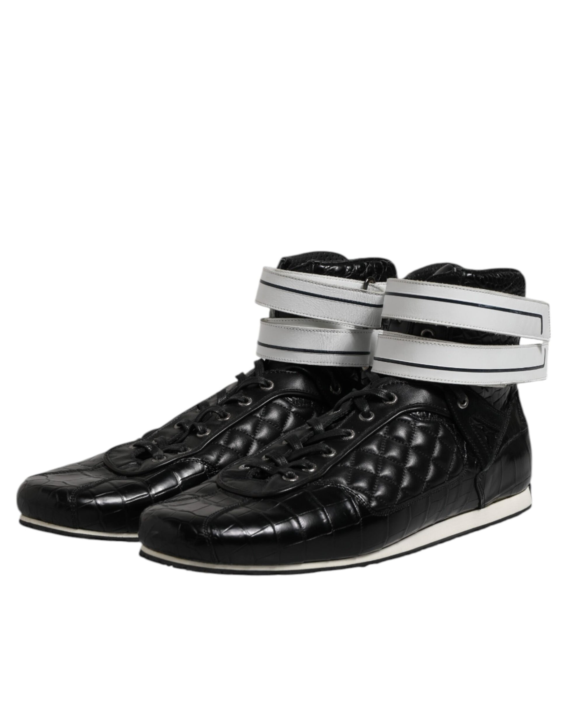 Pair of black leather shoes with white straps