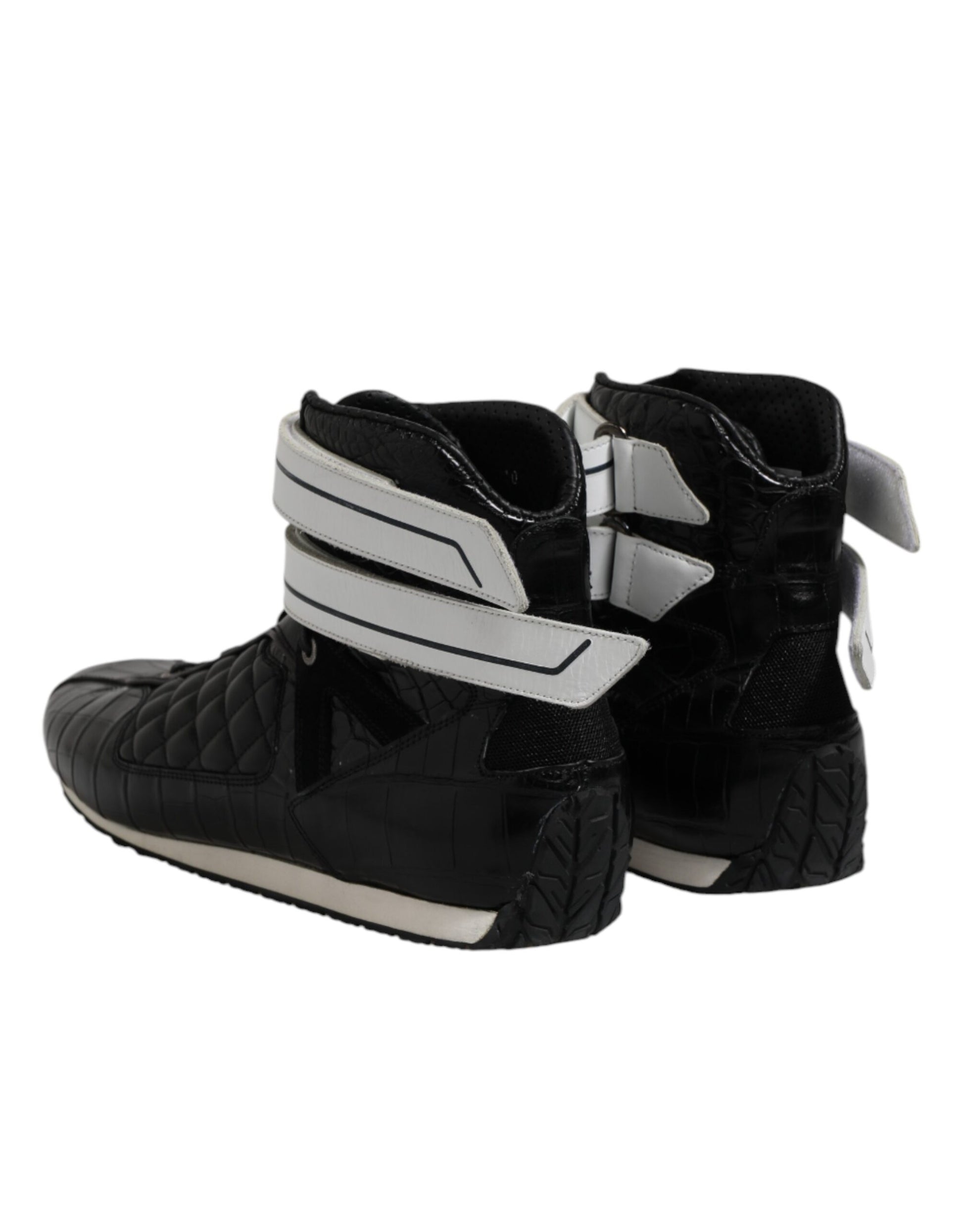 Pair of black boots with white stripes on sides