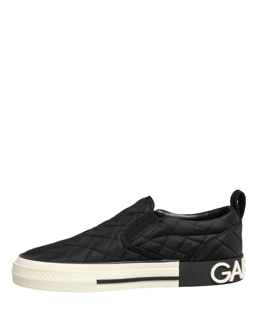 A pair of black quilted slip-on low top sneakers with a white sole