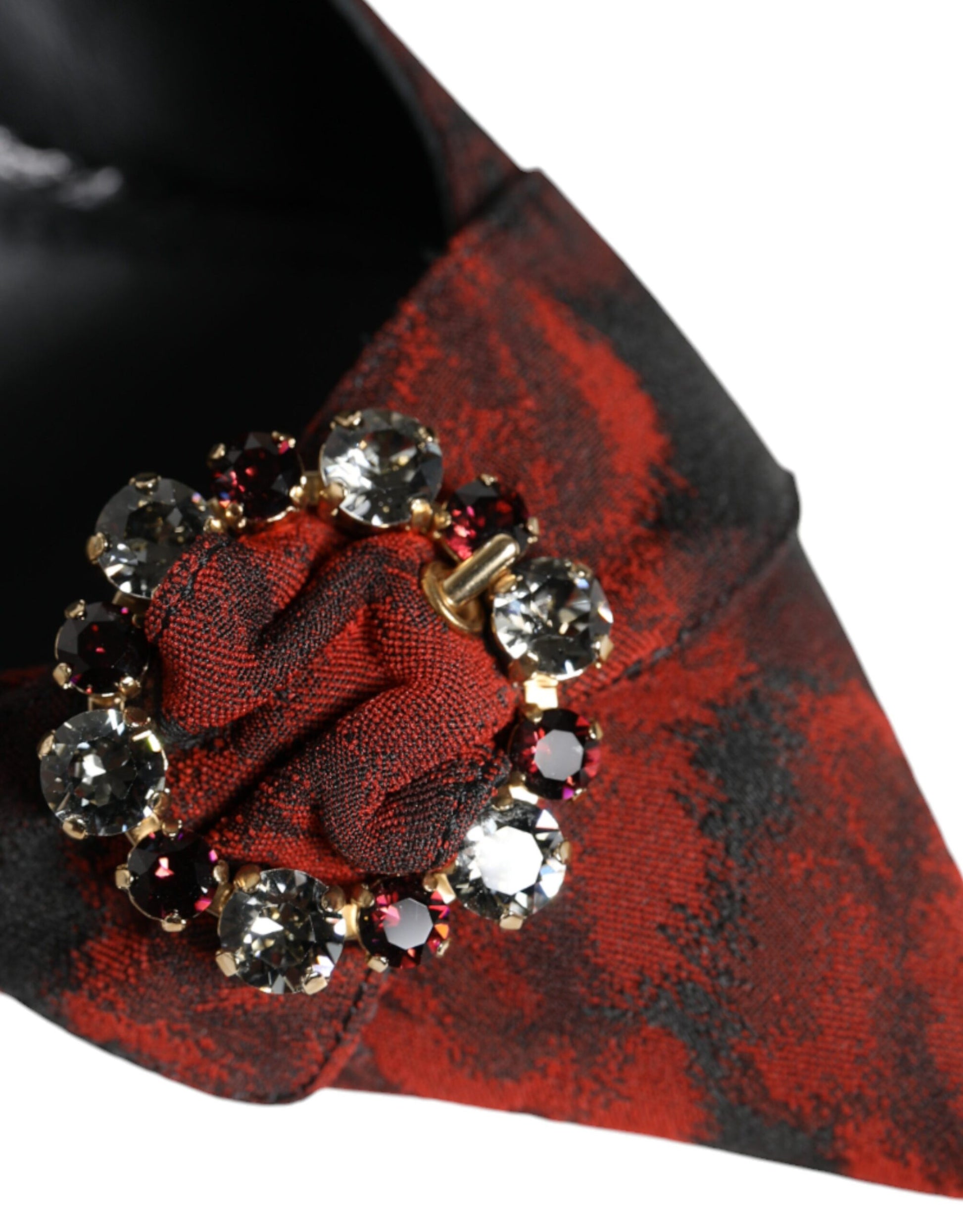 Red tie with gold and pink crystals on a black background