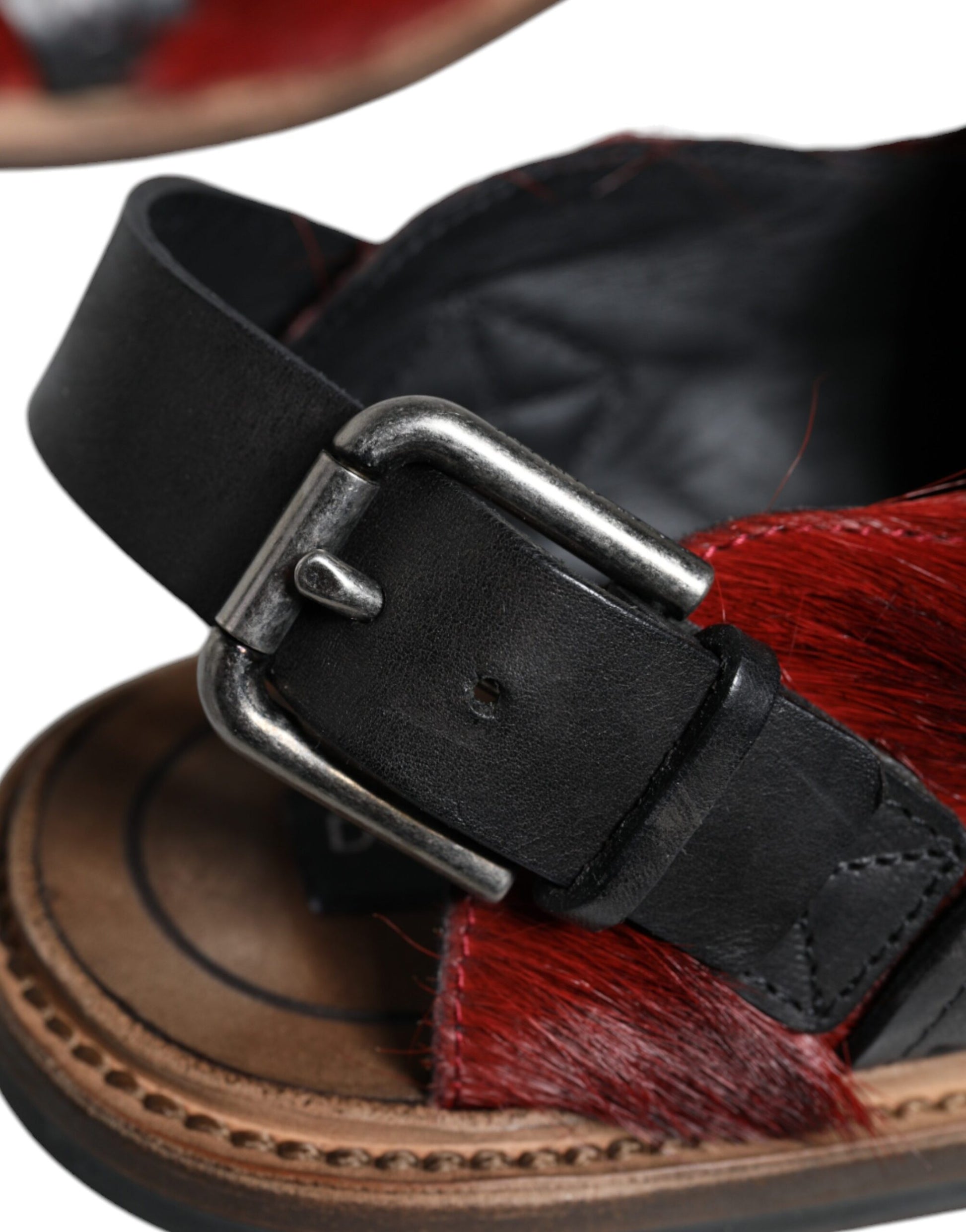 Black leather belt on brown sandal