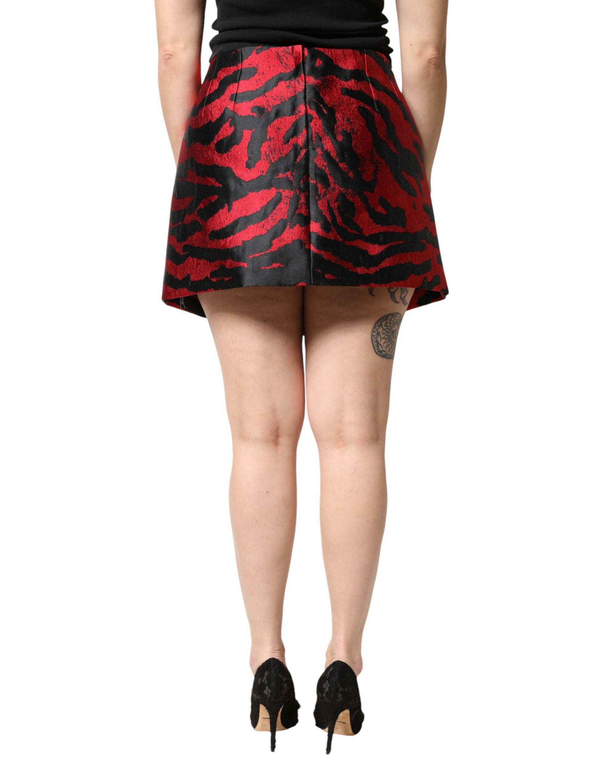 Short skirt with red pattern on woman's legs