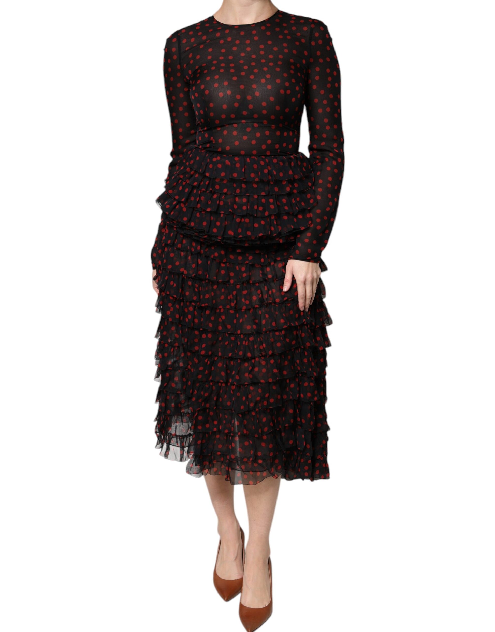 A black midi dress with red polka dots and layered silk skirt