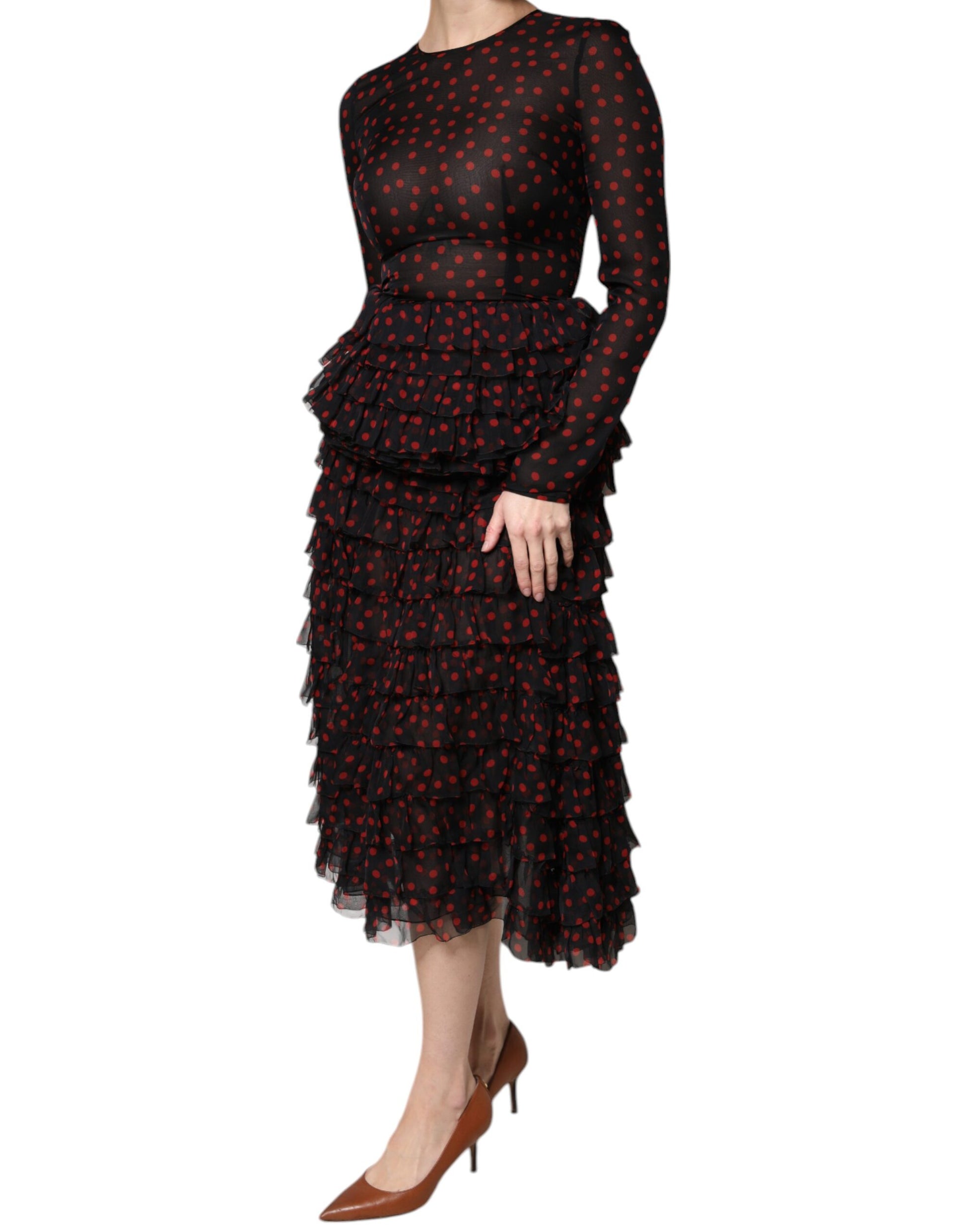 A black midi dress with red polka dots and a layered design