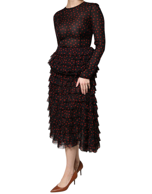 A black midi dress with red polka dots and a layered design