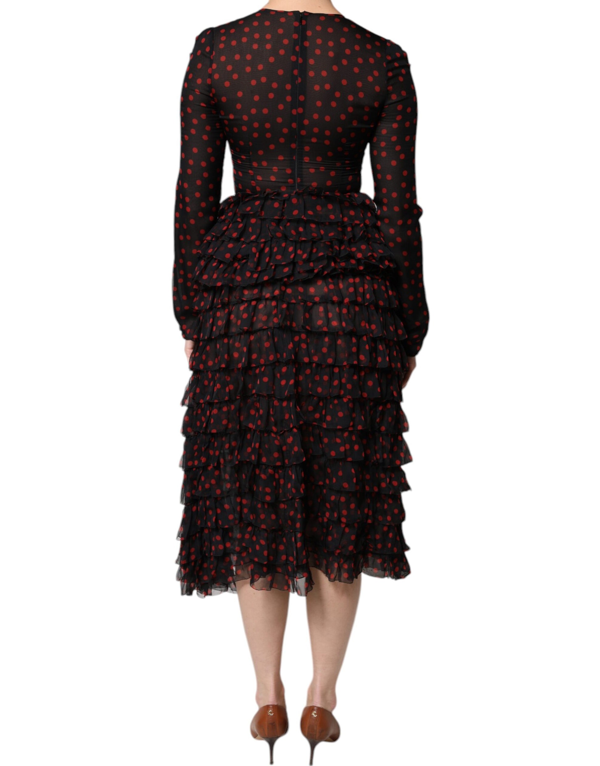 A black midi dress with red polka dots and layered ruffles