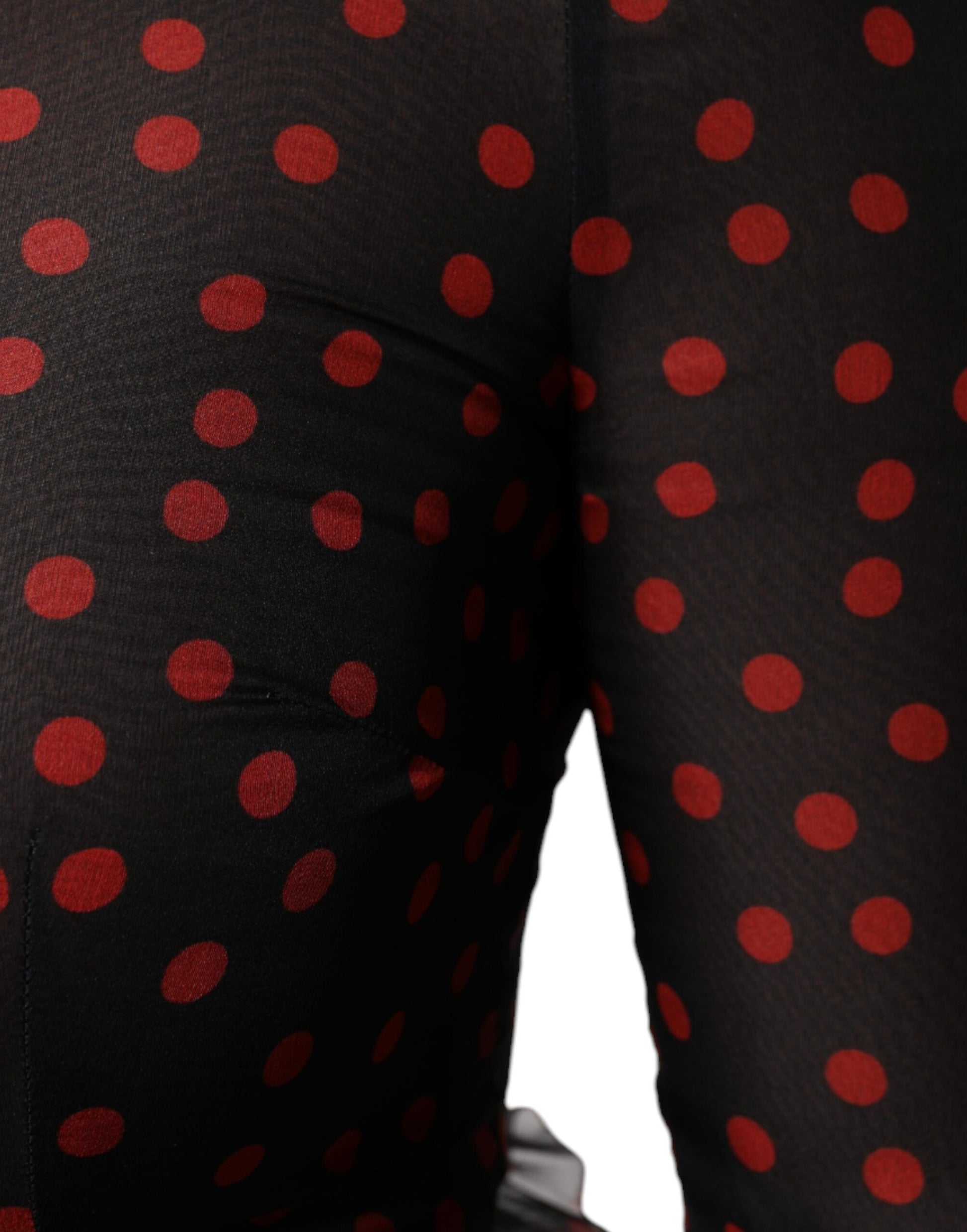 A pair of black silk leggings with red polka dots