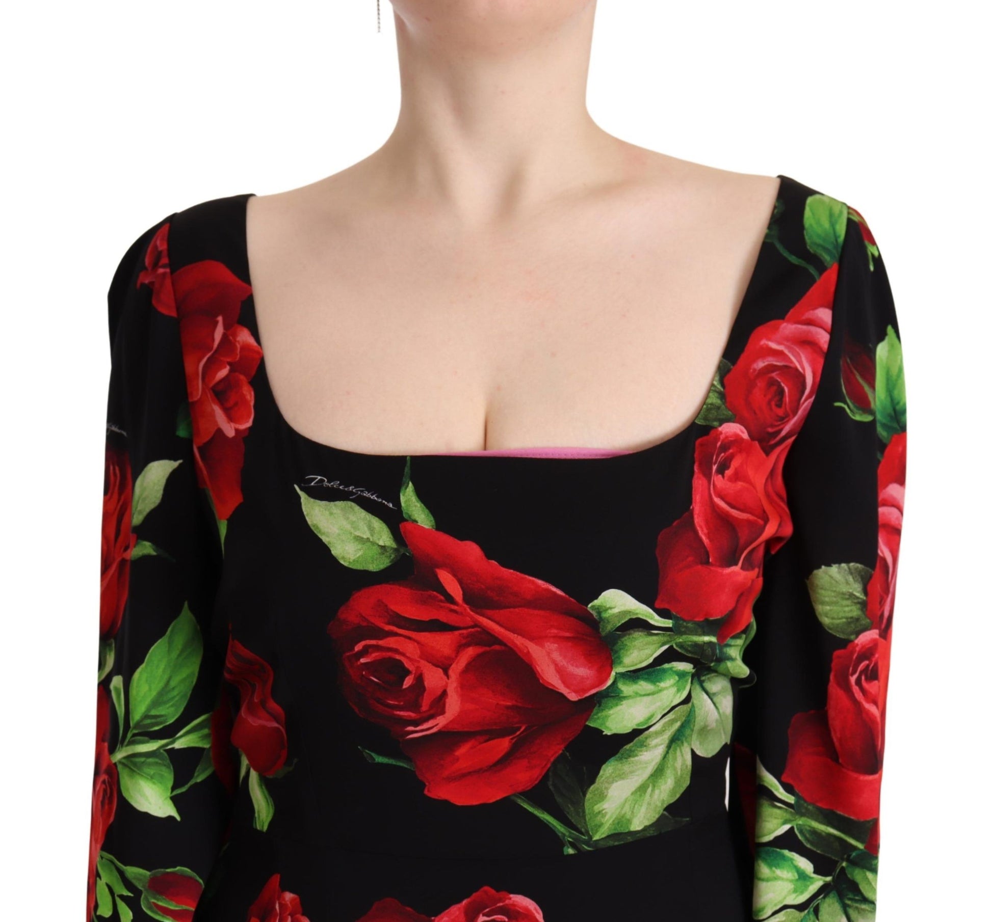 A black dress with red roses on it