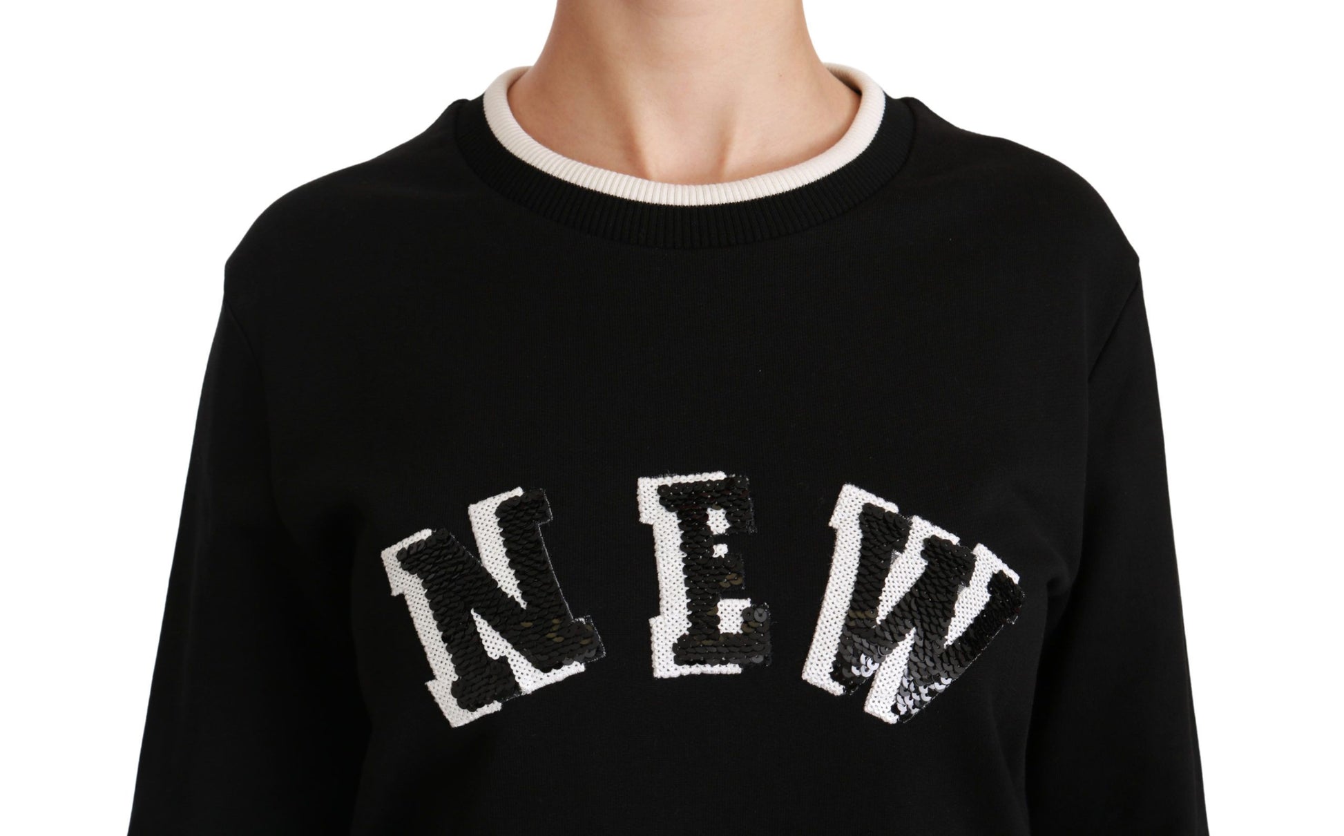 Black sweater with white lettering on front