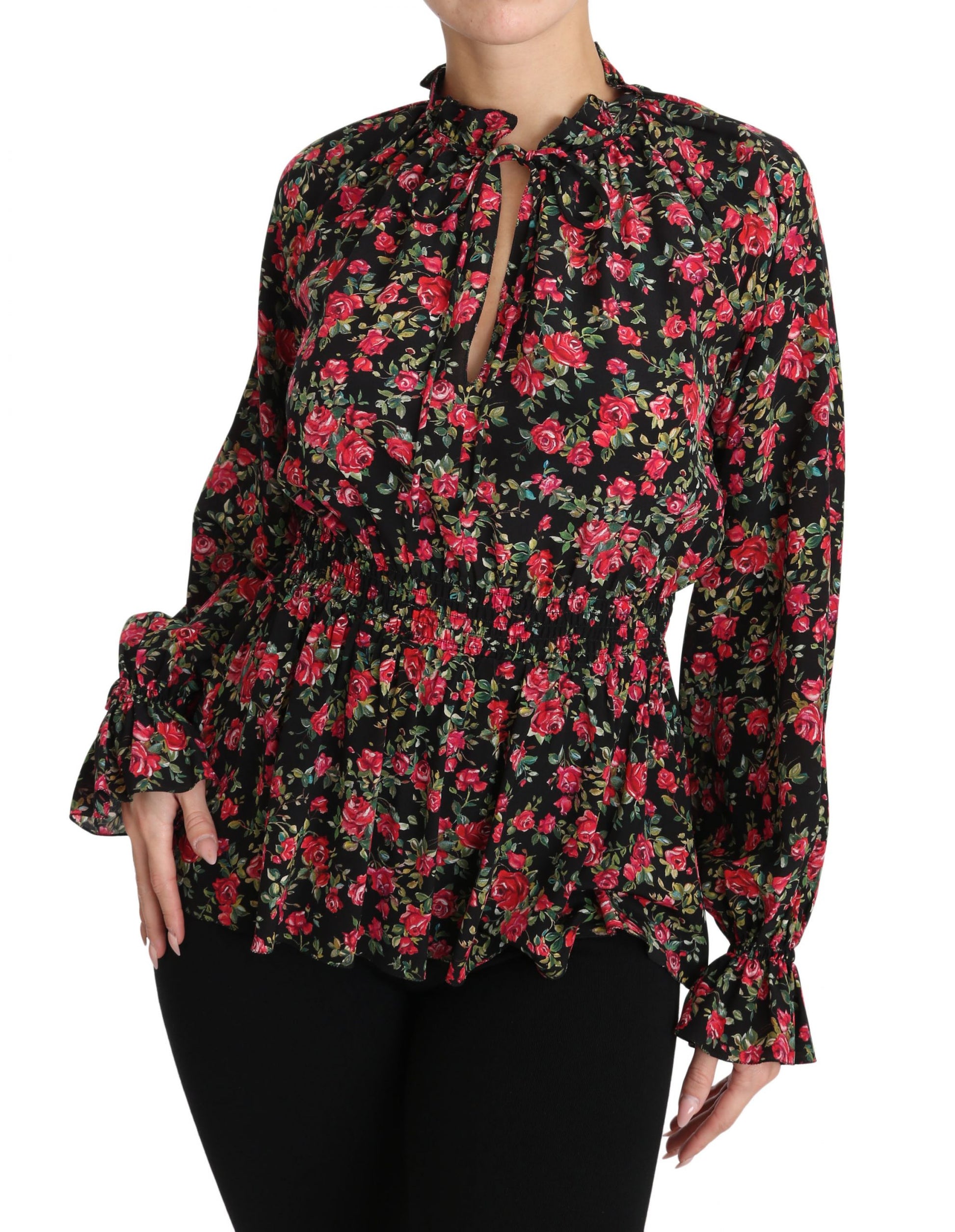 Woman wearing floral print blouse with ruffled sleeves