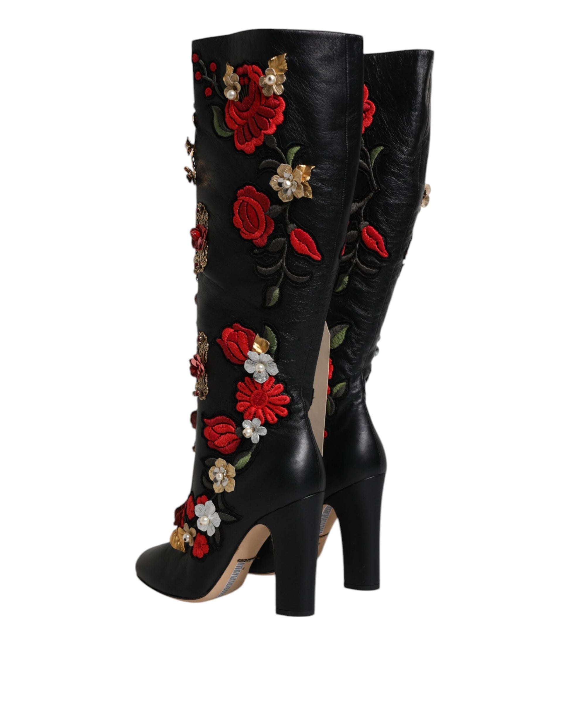 Black boot with red flowers and gold accents