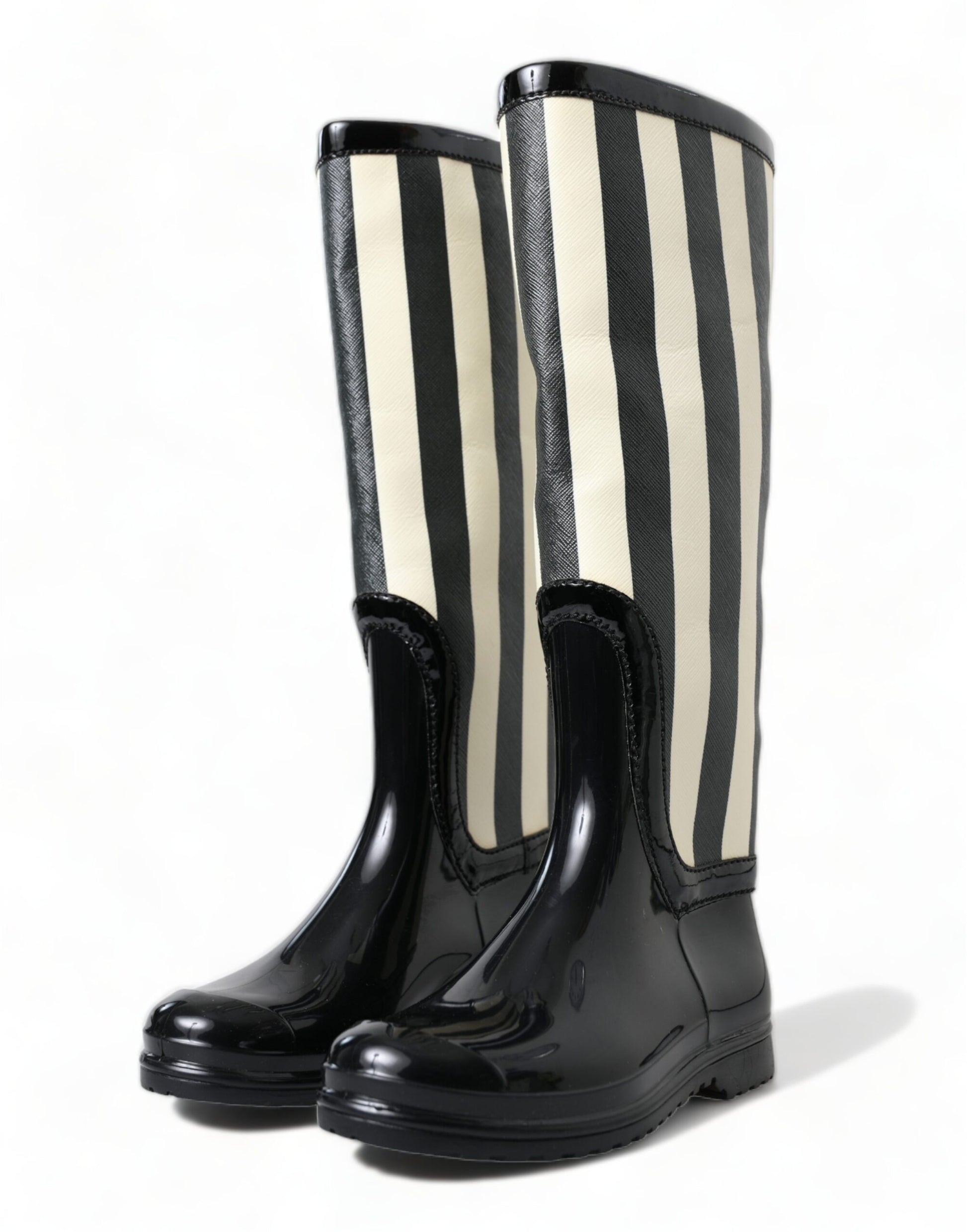 Pair of black rain boots with white stripes and buckles