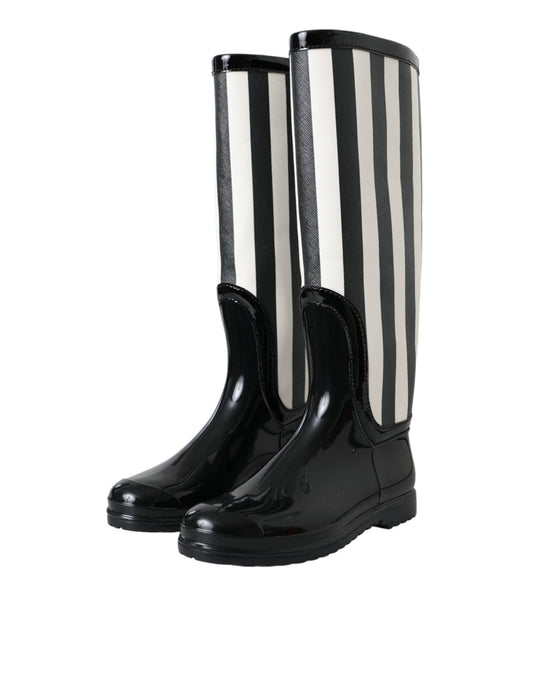 Pair of black rain boots with white stripes